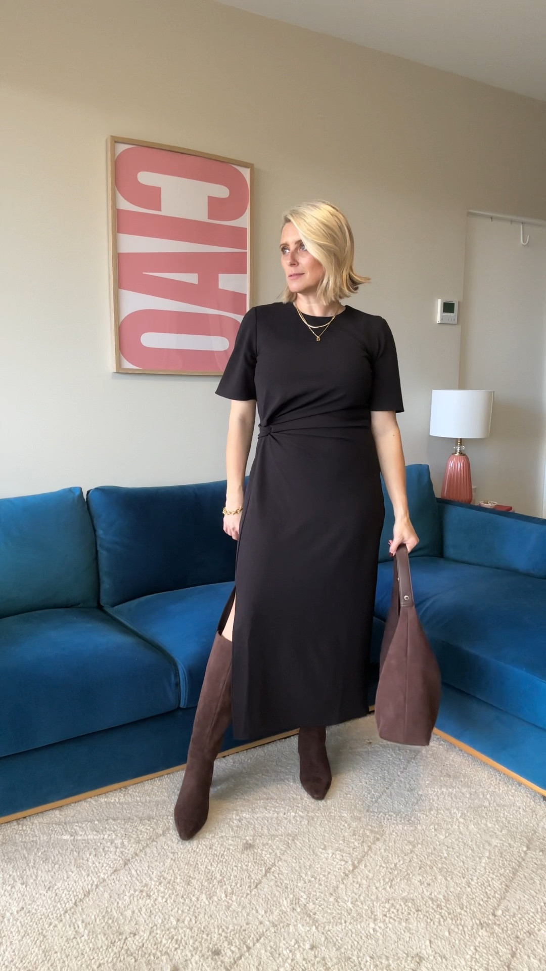 This little black midi dress can be easily styled for work and play with a mix of accessories. 
And the twist detail provides soft ruching across the mid-section which is great for anyone who feels self conscious of their stomach. 
Plus it’s made from a textured crepe with an element of spandex so it’s fairly crease resistant  

I’m wearing a size 10 (it has a size zipper)  

#LTKworkwear #LTKaustralia #LTKtravel