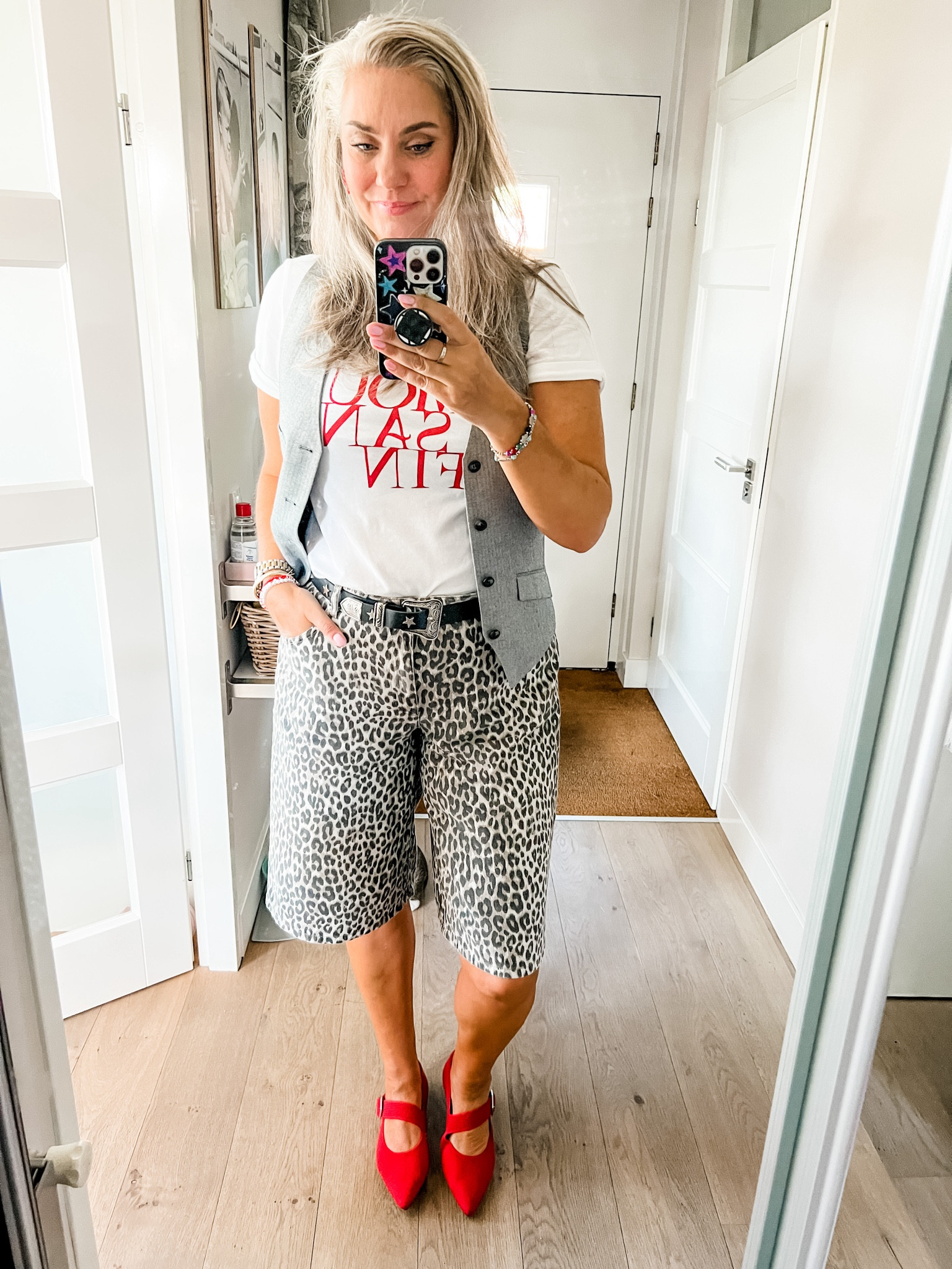 Ootd - Saturday. Leopard print jorts, star studded belt, graphic print t-shirt (old H&M), red Vivaia Mary Jane’s, red coral earrings and a men’s waistcoat (secondhand). 



#LTKstyletip #LTKeurope #LTKnederlands