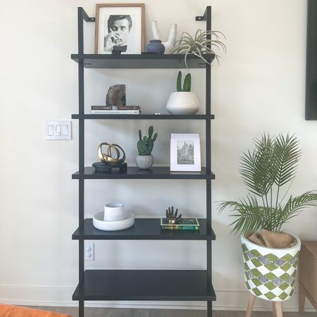 Black bookshelf from CB2. Modern bookshelf for home decor. Modern shelving ideas. #shelf #shelvingideas #modernbookcase #shelfstyling #shelfie #modernhomedecor #livingroomdecorideas #blackbookshelf #openshelves #bookshelfstyling 

#LTKSeasonal #LTKstyletip #LTKhome