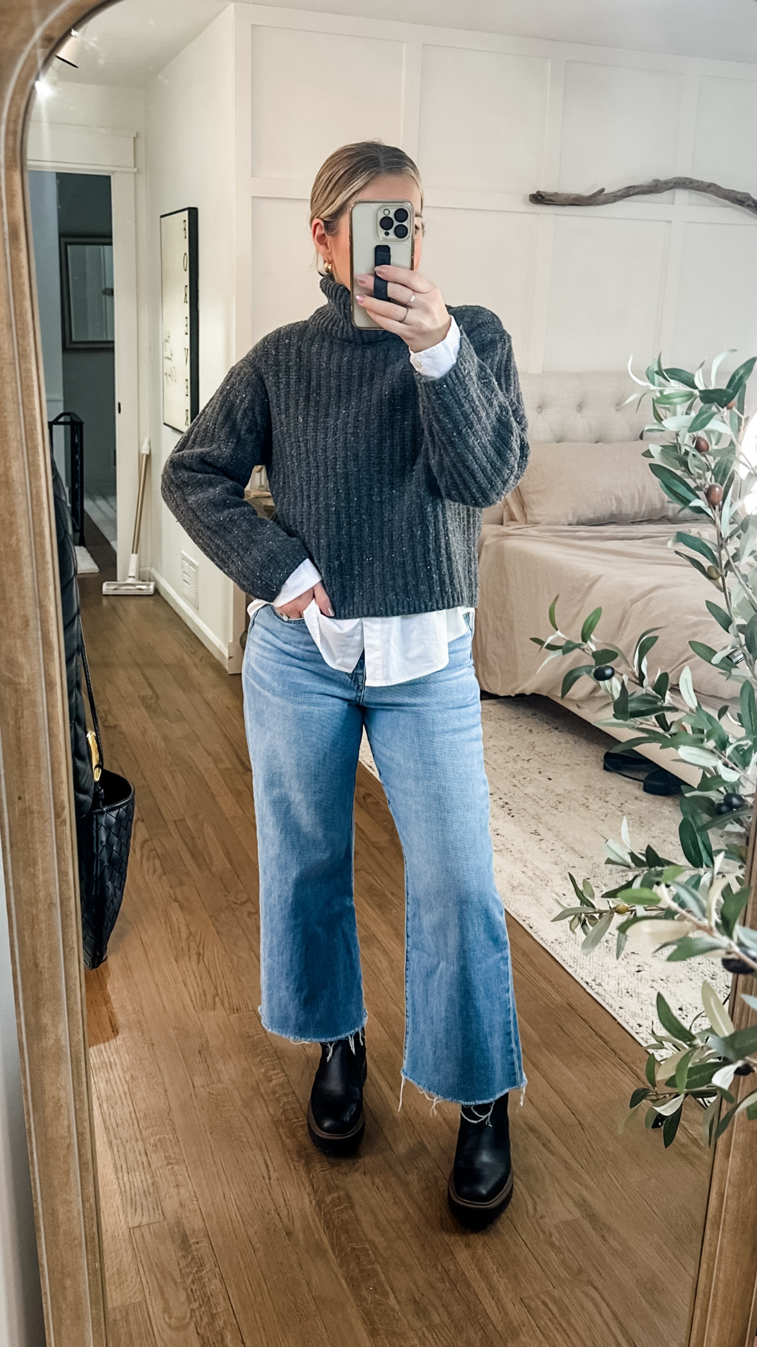 What I wore to work as a teacher in the snow. Loving these cropped wide leg jeans bc the hem stays dry and my weatherproof laguna boots were perfect for the wet snow and sleet. Layer a chunky turtleneck over a white button and pull the hair back in a slick messy bun for a more polished look. Add chunky gold hoops to dress it up and throw on a black overcoat! Medium sweater and button down, tts jeans  

#LTKstyletip #LTKworkwear #LTKmidsize