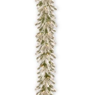 9ft. Pre-lit Feel Real® Snowy Sheffield Spruce Artificial Christmas Garland with 70 Clear Lights | Michaels Stores
