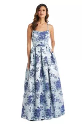 Morgan & Co. Long Broccade Box Pleat Ball Gown W Spaghetti Straps, X Back, And Cut Out Back Detai... | Belk