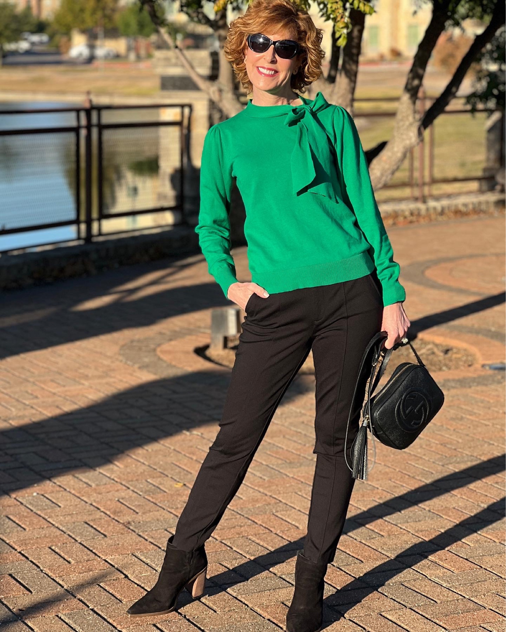 Holiday outfit, Fall sweater, Bow sweater, holiday sweater, bow neck sweater, tie neck sweater, tory Burch sunglasses Fall outfit, fall sweater, bow tie sweater, bow neck sweater, green sweater, green top, fall top, black knit pants, Ponte knit pants, Ponte pants, black booties, black suede booties, block heel booties, tory Burch earrings, logo earrings, designer earrings

This professional look is perfect for a day of meetings, and the cut hand tie bow neck and gathered sleeves in this sweater make it great for a zoom meeting too! 

I paired it with the perfect Ponte knit black pants and black pointed toe booties. I kept my accessories clean and simple for a workwear look that exudes confidence.

#LTKstyletip #LTKSeasonal #LTKunder100