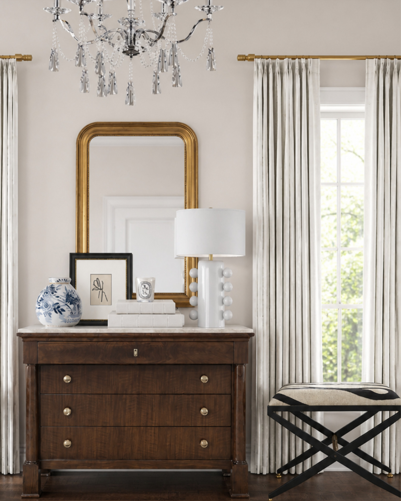 Classic, collected, and polished without feeling too formal. I love the mix of a warm wood dresser, pleated drapes, brass details, a crystal chandelier, and a little blue-and-white accent for contrast. It’s an easy formula for making an entryway or bedroom corner feel more finished: start with one substantial anchor piece, layer in height with a mirror and lamp, then add smaller pieces that bring texture and personality.

Linked similar dressers, pleated curtains, brass rods, benches, mirrors, lamps, and blue-and-white decor.

This post contains affiliate links, which means I may earn a commission if you shop through my links at no extra cost to you. 

 #LTKHome