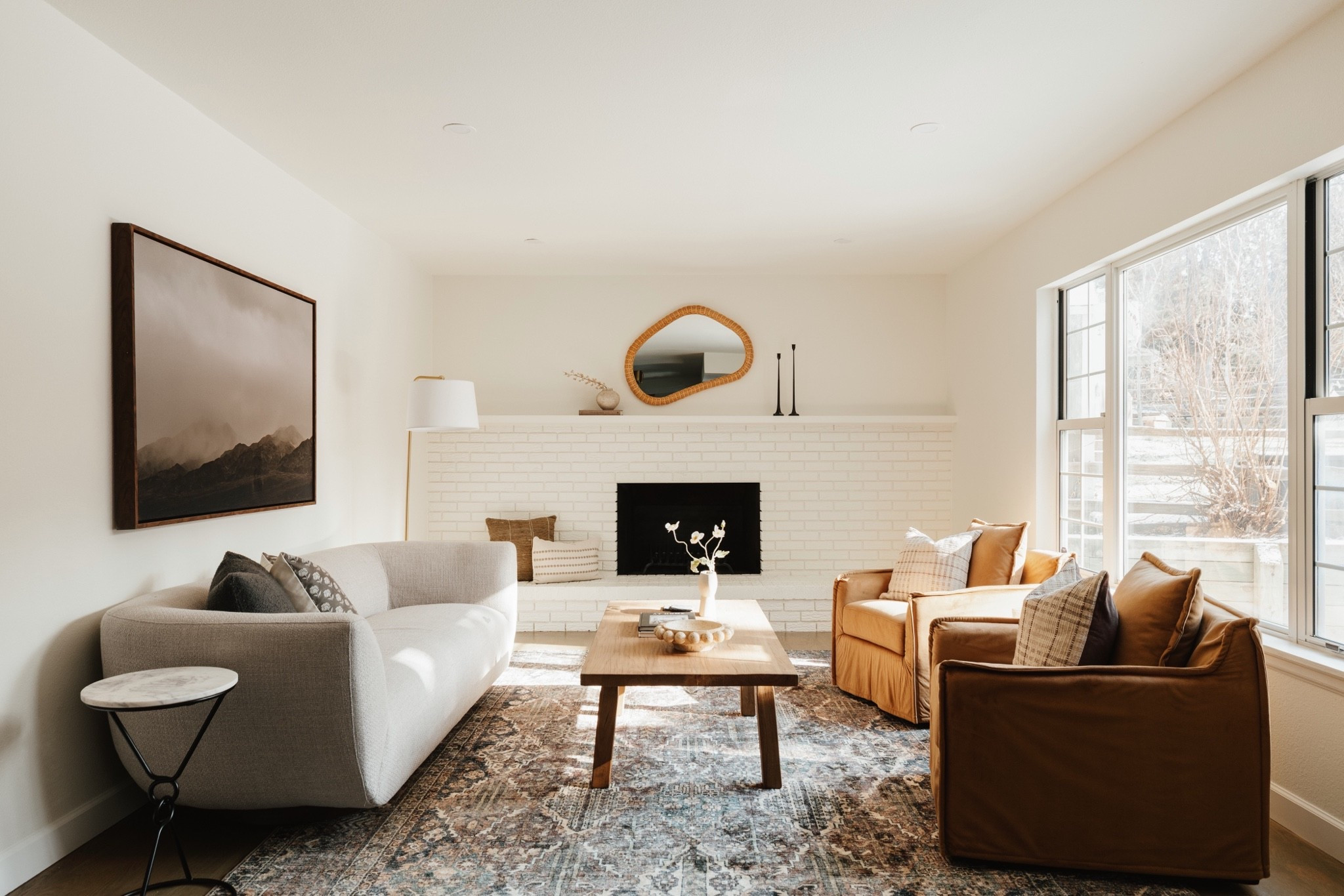 living space with a taupe sofa, brown upholstered chairs, and a distressed vintage rug

Living room, coffee table, rug, vintage

#LTKHome