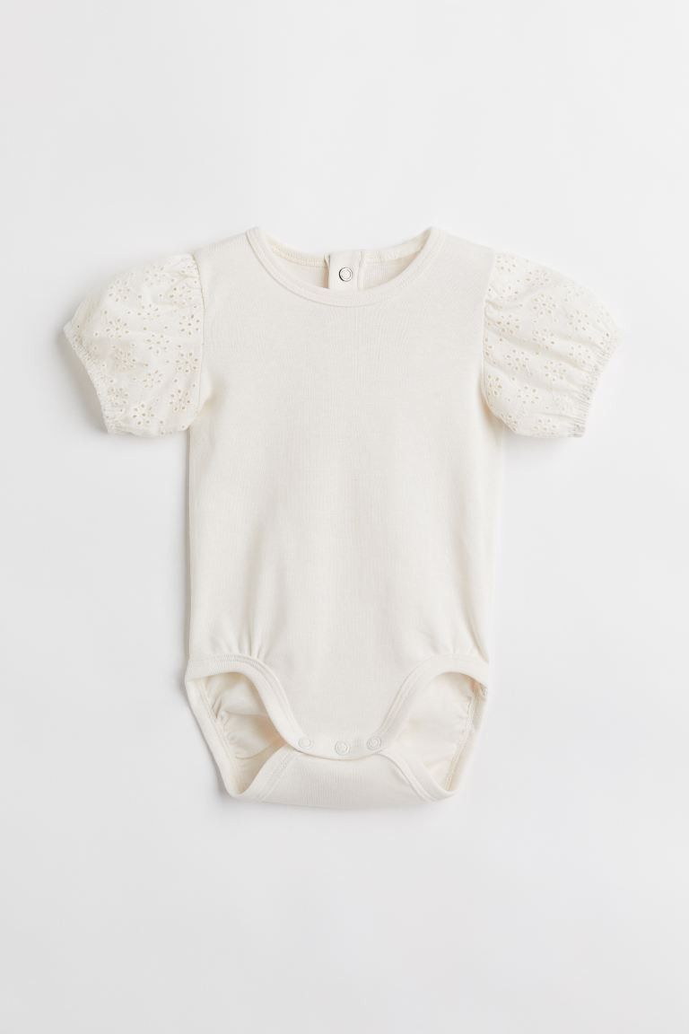 Bodysuit in soft cotton jersey. Round neckline, snap fasteners at back of neck, and short puff sl... | H&M (US + CA)