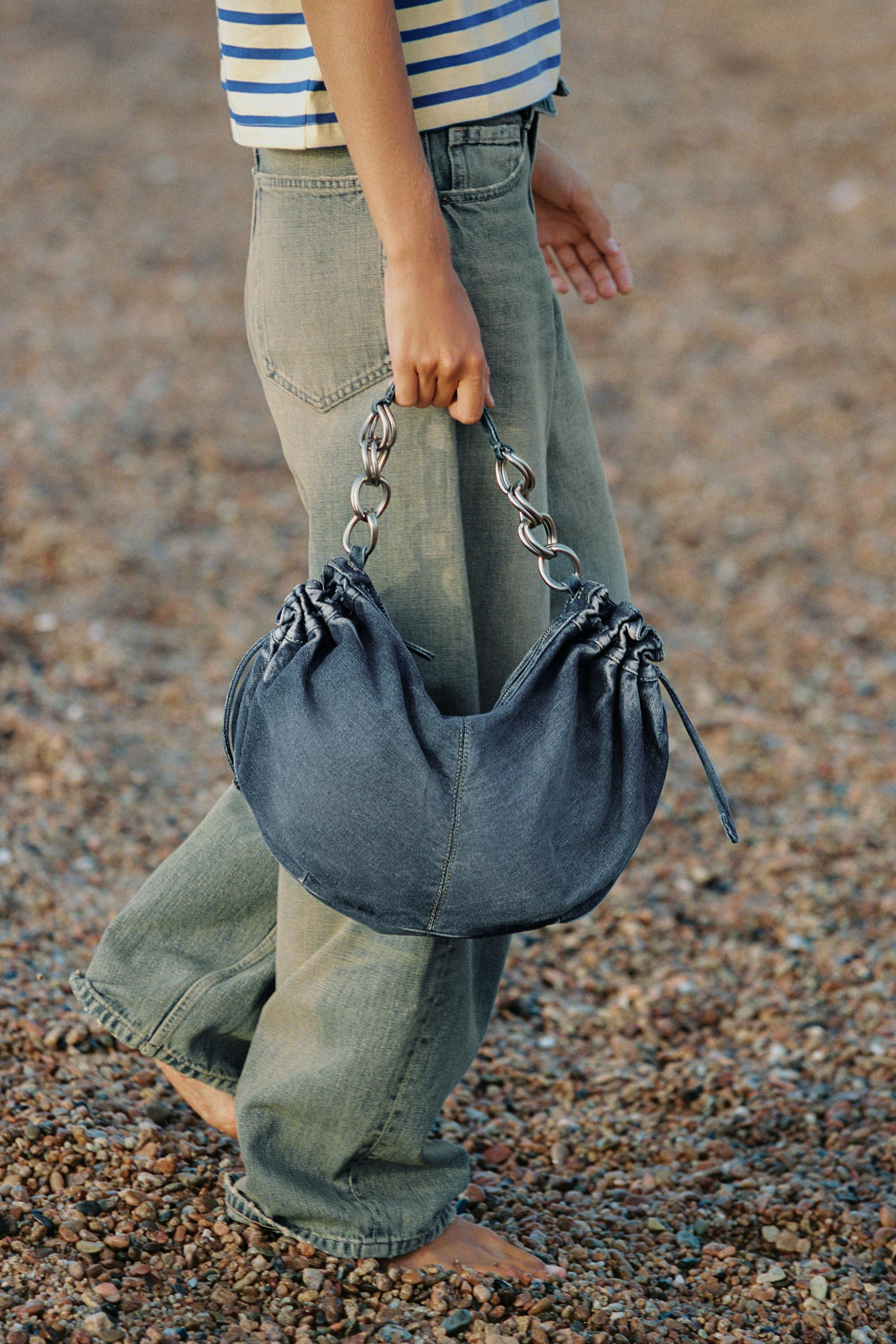 Shoulder bag featuring a denim body with gathered side details and adjustable pull tabs. Includes... | Zara US