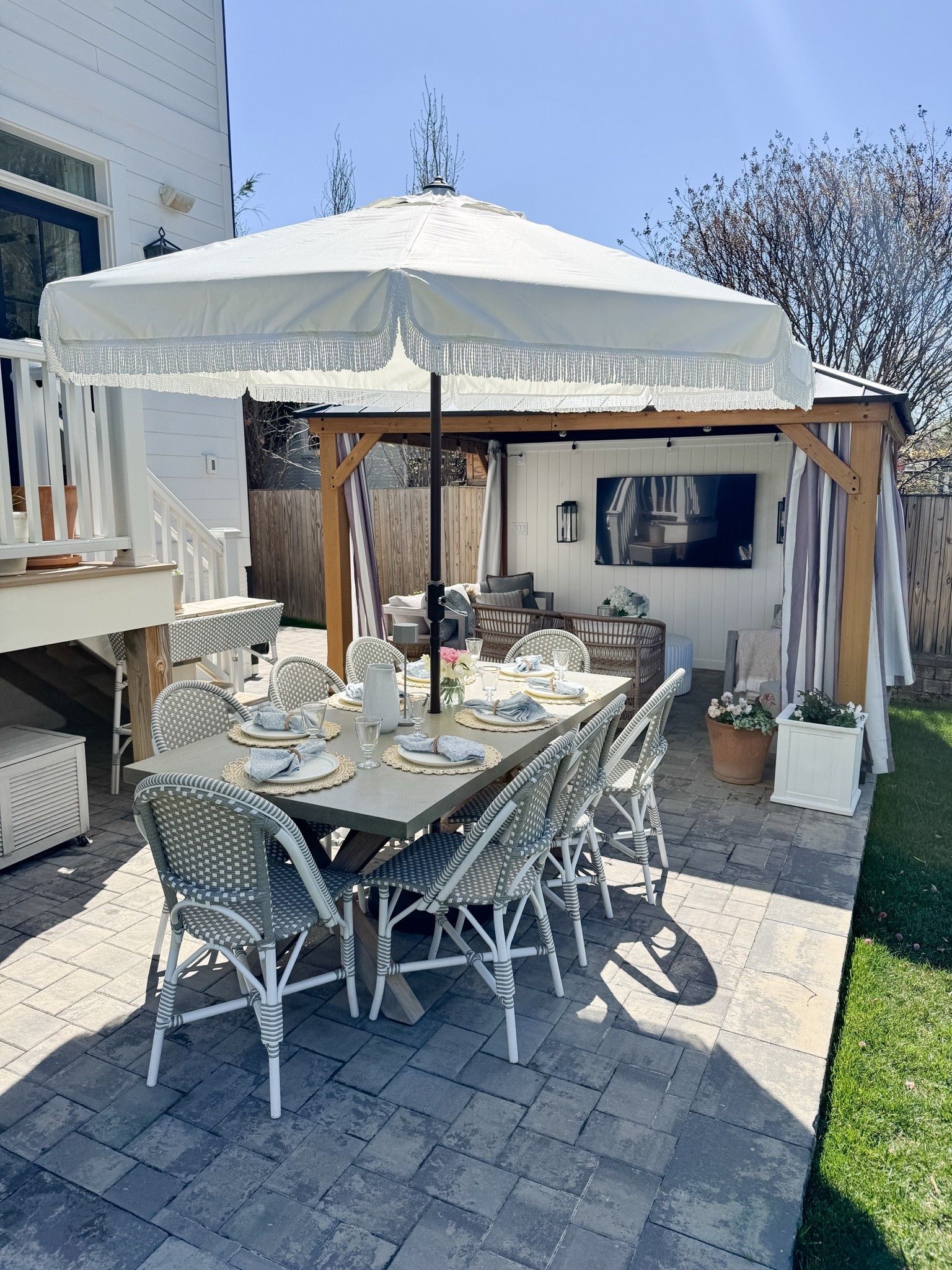 Nancy Myers inspired outdoor patio with coastal outdoor dining, Fri she umbrella, gazebo

#LTKHome #LTKSaleAlert