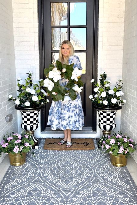 My spring front porch! Wearing a size small in my dress! The planters are in the size large, rug is a 5x7! Floral is on my Amazon!

Front porch, spring porch, Modern Locke, magnolia wreath, magnolia flowers, faux, flowers, doormat, outdoor rug, Walmart, Walmart, fines, Abercrombie, dress, Abercrombie, outfit, white dress, spring dress, outfit, beach, vacation, outfit, white flowers, Mackenzie Childs 