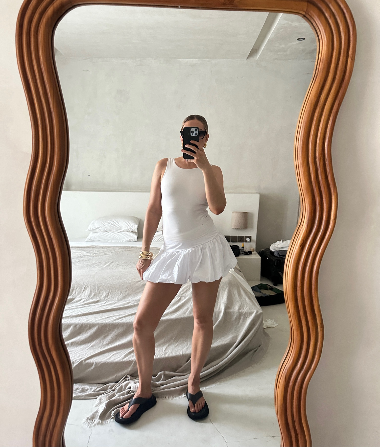 Cool girl day look featuring a white bubble skirt, white low back singlet, statement sandal and structured accessories. 

#LTKfindsunder100 #LTKaustralia #LTKworkwear