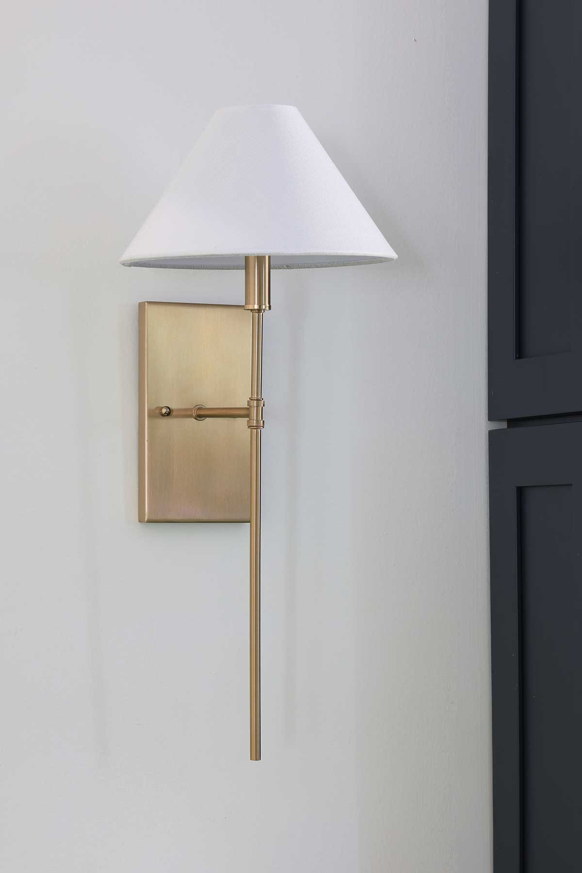 A brass wall sconce with an empire shade is a classy touch to light up any wall.   

 #LTKHome