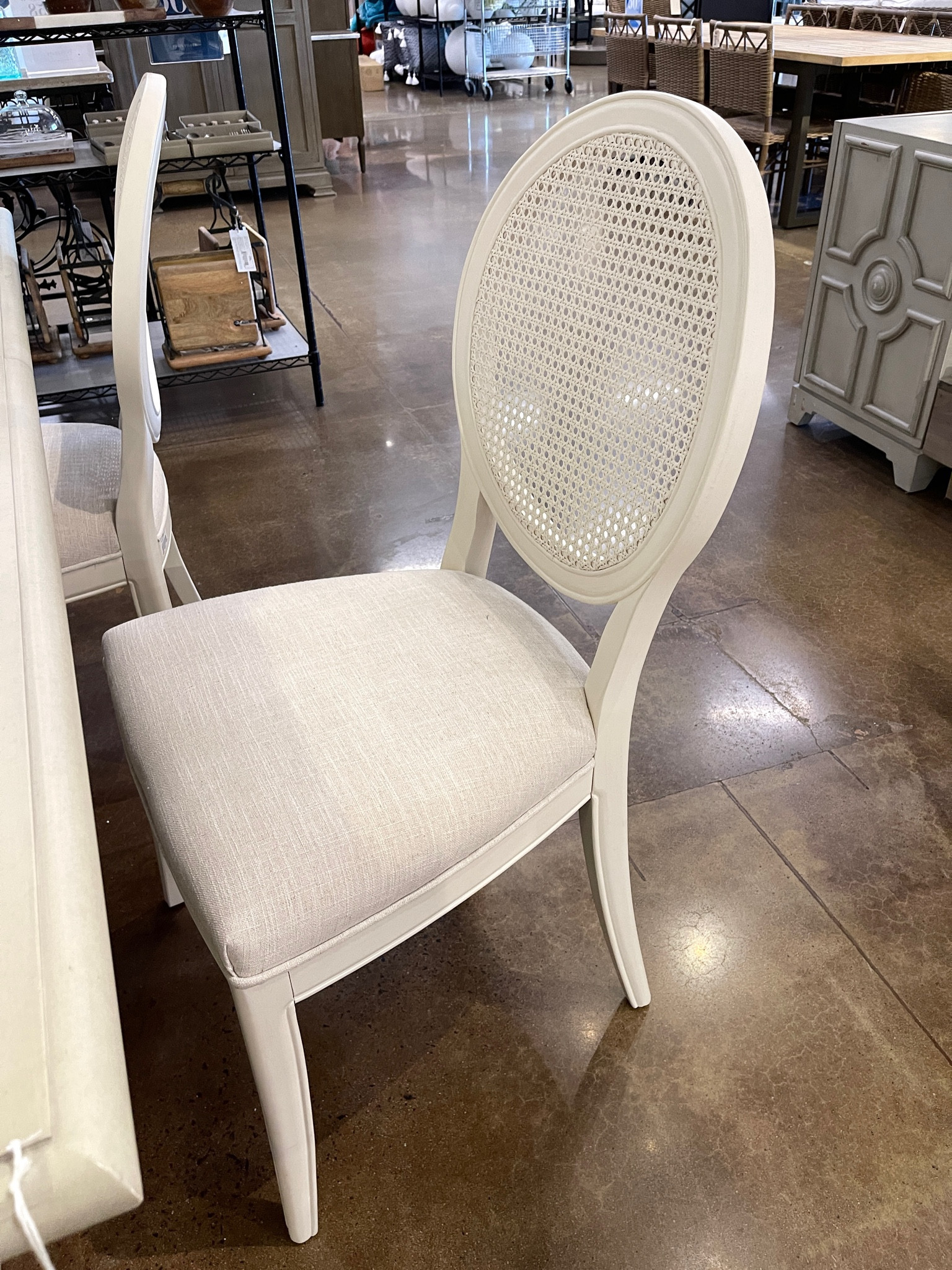 Elegant white cane chair! Solid wood frame and upholstery enhanced by a round back. French provincial style with classic details - perfect for any formal dining room!  🤍

#LTKhome #LTKstyletip #LTKparties