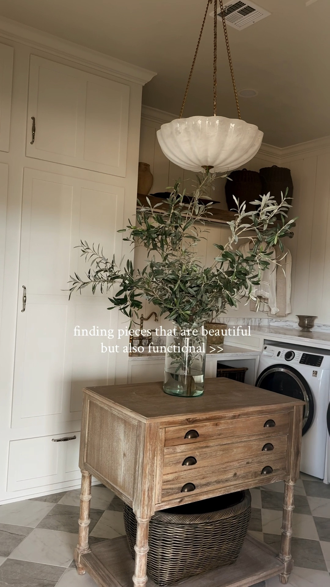 This island I added to our laundry room is actually meant for a kitchen but it’s the perfect size for a little extra counter space in here as well. The drawers open both directions. I needed something I could move if needed because the attic ladder is in the ceiling and comes down into this room. I love the vintage wood look! 

#LTKHome