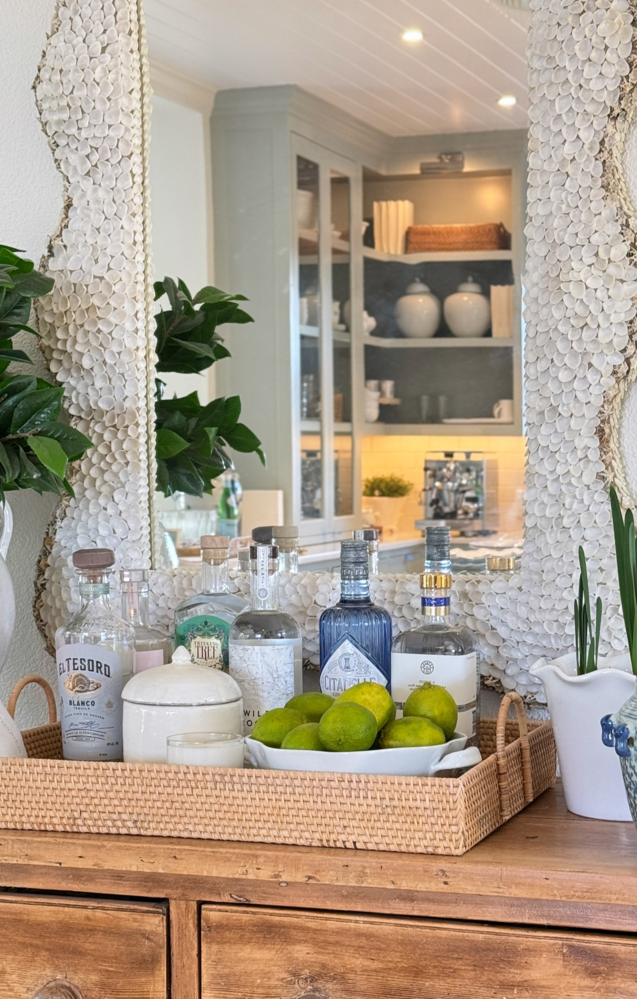 Entryway/bar cart update! Love this pretty Isabella shell mirror - I got the tall one! 

 The cabinets in the background are Farrow & Ball Light Blue

#LTKHome #LTKParties #LTKSeasonal