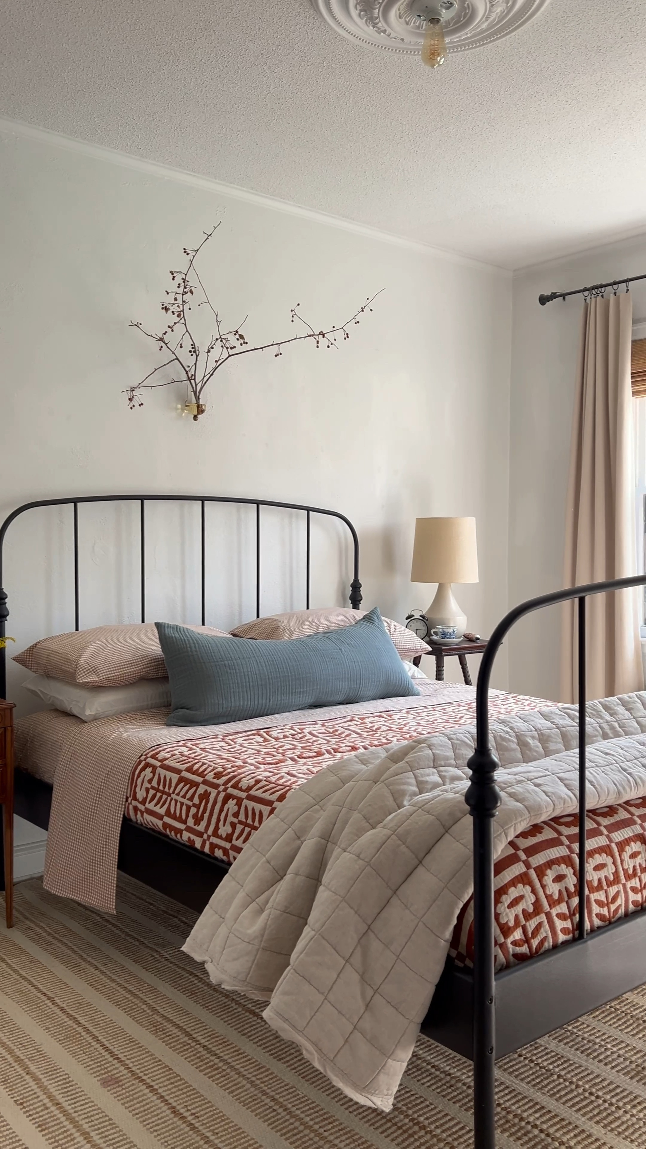 Making the bed helps me feel productive first thing in the morning and sets the tone for the day. As we head into cooler months, I’m leaning into  the warmth and familiarity of Jewel tones and cozy heirloom patterns.

The Stillwater quilt (gifted) with its vintage-inspired floral pattern creates a beautiful pattern-play layered with gingham sheets. As a textile nut, I’m over here geeking out at the delicious matelasse construction!

Rounding things out with a steely blue-green lumbar pillow. I can’t be trusted to arrange several throw pillows every morning, but tossing on a long lumbar is very doable. And finally, a little bit of outdoors above the bed! Shop these pieces for your own fall reset! #ad 

#LTKSeasonal #LTKHome #LTKVideo