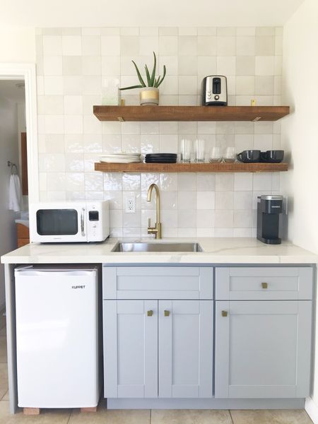 Let’s talk vacation rental design!  I’m currently designing a short term rental property near Joshua Tree.  I’m choosing some splurges, and also looking for second hand vintage finds.  It’s all in the mix.  This was a mini-kitchen I helped design a few years ago in my friend’s downstairs that she turned into an Airbnb.  People in California have to house hack!  It’s expensive around here so extra streams of income can’t hurt.  Turn an unused corner into an adorable kitchen like this and rent out your downstairs.  

#LTKHome #LTKStyleTip