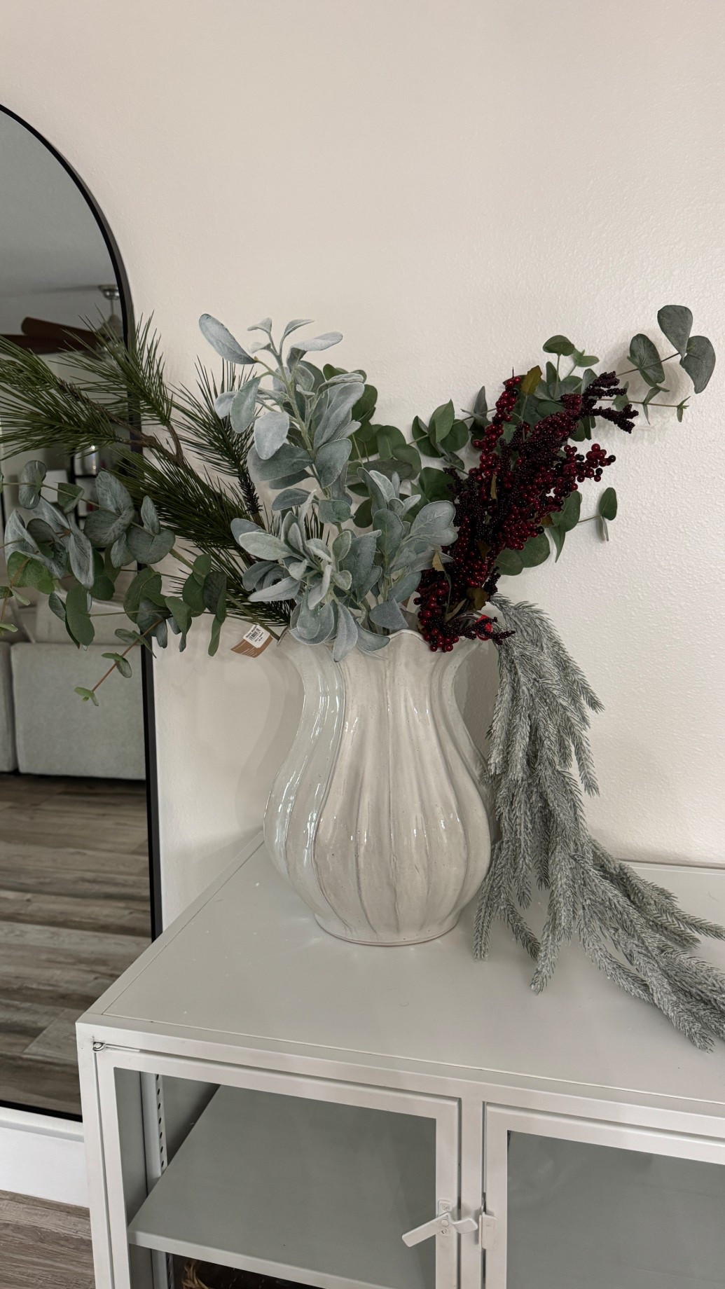 This planter looks so much more expensive than it is, filled with faux greenery from Hobby Lobby!