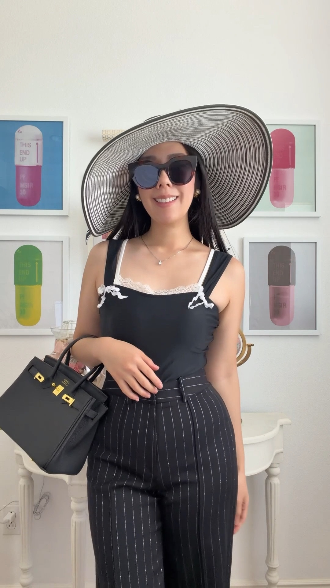 Swimsuits as top are great for short trips outdoors unless I’m actually at the beach or poolside! I paired this with my high waisted pinstriped pants and a floppy hat for a classy old money look. I love how this swimsuit has double straps, bow detailing and ruffles on the front. 

#rihoas #swimsuitseason #oldmoney #onepiece #pinstripepants #floppyhat #swimseason #resortstyle

#LTKSwim #LTKgrwm #LTKPetite