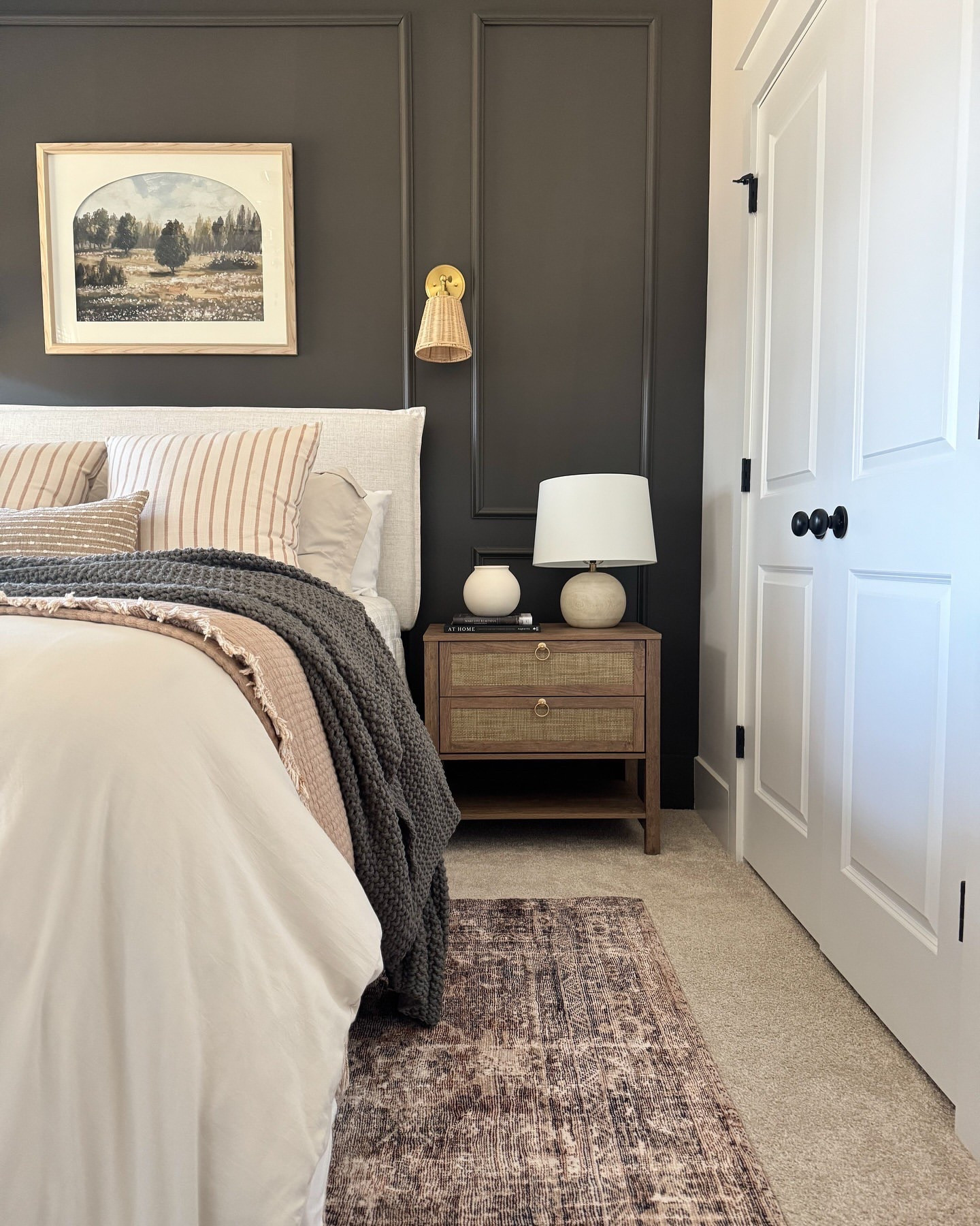 Guestbedroom, moody accent wall, upholstered bed, moody dark wall, bedroom design, bamboo shades, wall sconces, art above bed, guest bedroom ideas 

#LTKFamily #LTKHome