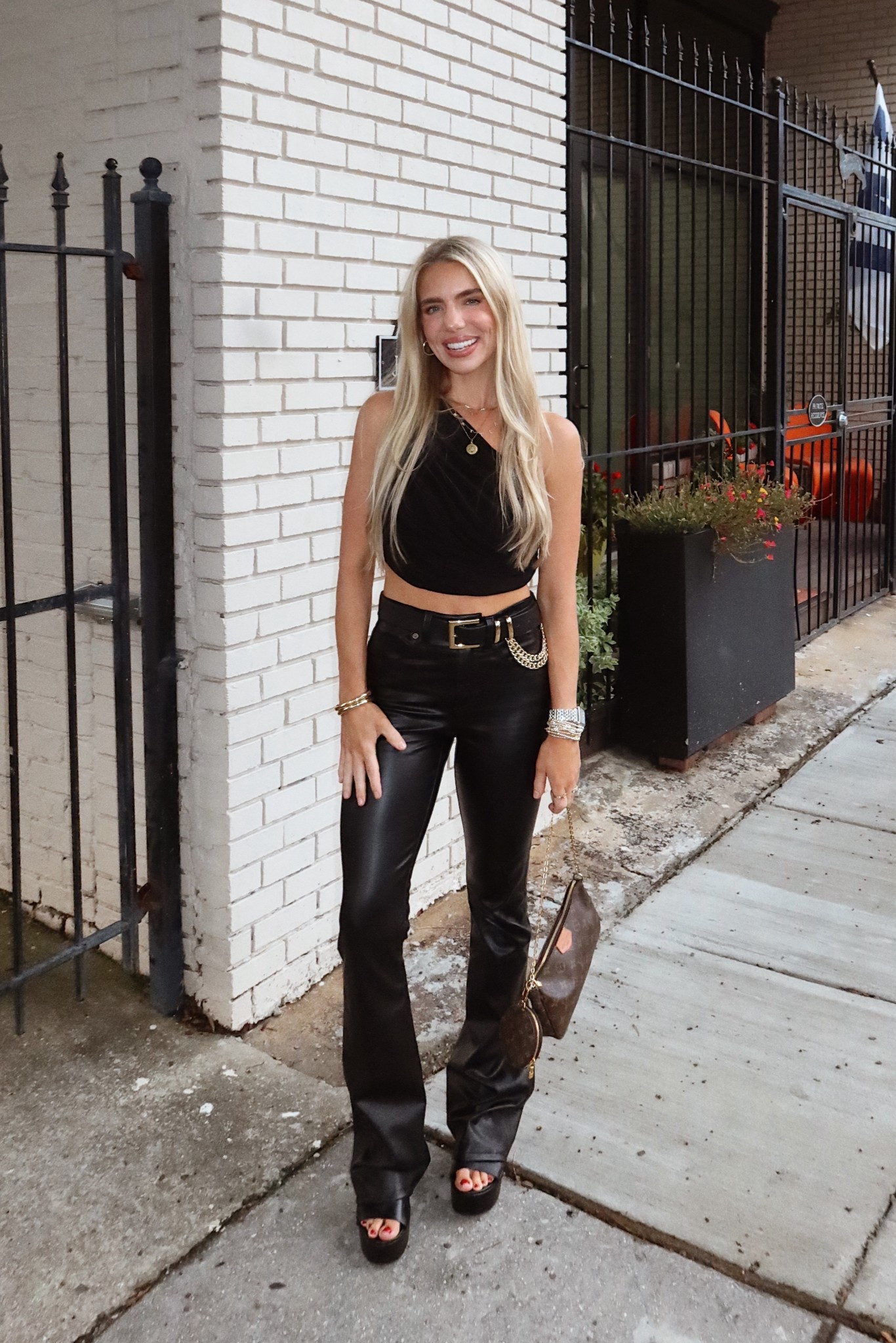 Dropped below 100° outside so naturally I found these black leather flair pants on clearance at Saks and had to wear them the same day lol. They are Veronica Beard and sold out at most places, but were on major clearance so I linked what I could find. Also, this Norma Kamali top is so old and I have worn it so much but it is so great and versatile, and same with this be below the belt, black and gold chain belt. Have worn it countless times!! Love, and all black look, especially when it rains at the drop of a hat these days haha 🖤🖤

#LTKSaleAlert #LTKStyleTip #LTKSeasonal