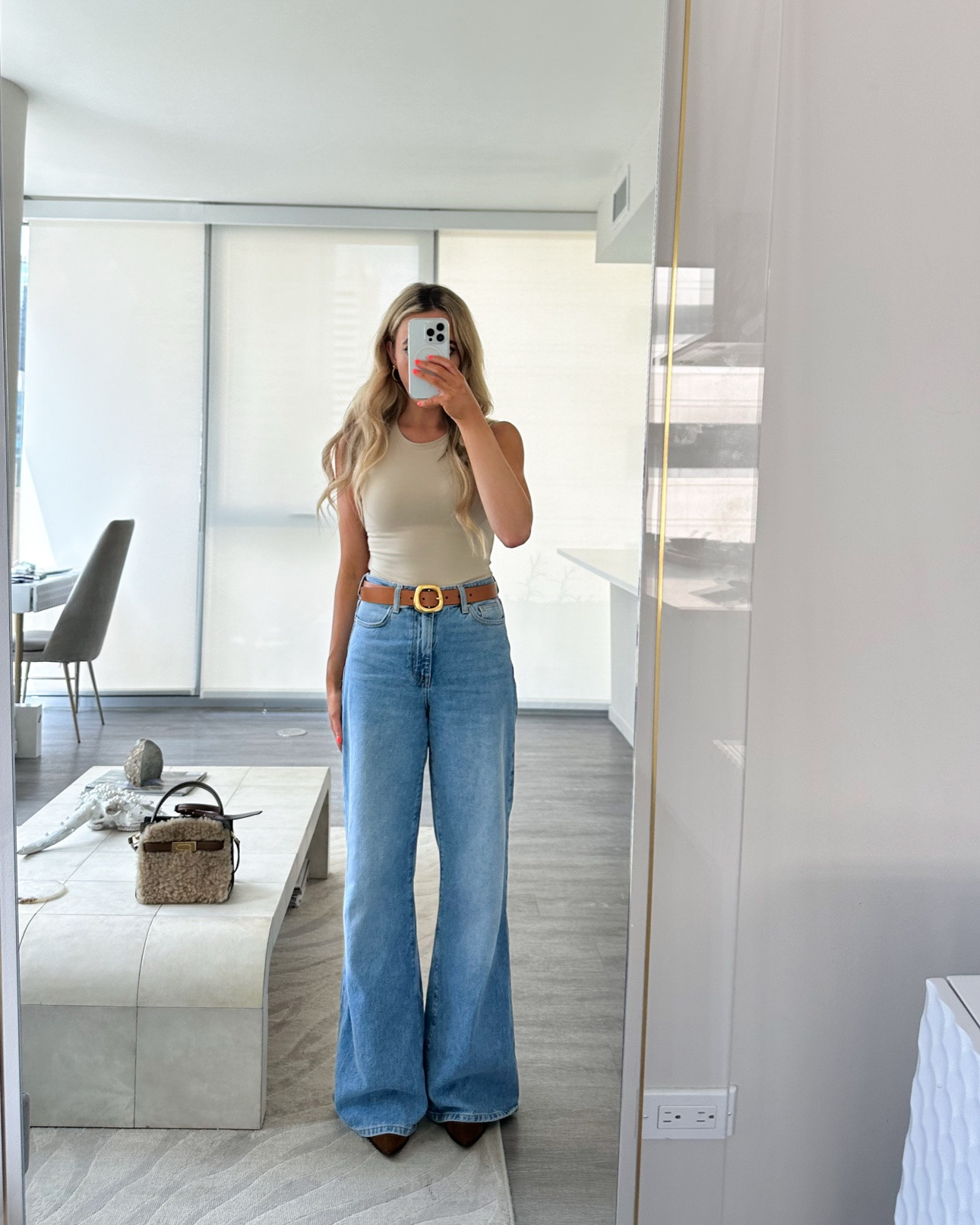 recreate this easy wide leg jeans outfit by pairing your jeans with a simple tank, bodysuit or tee + belt