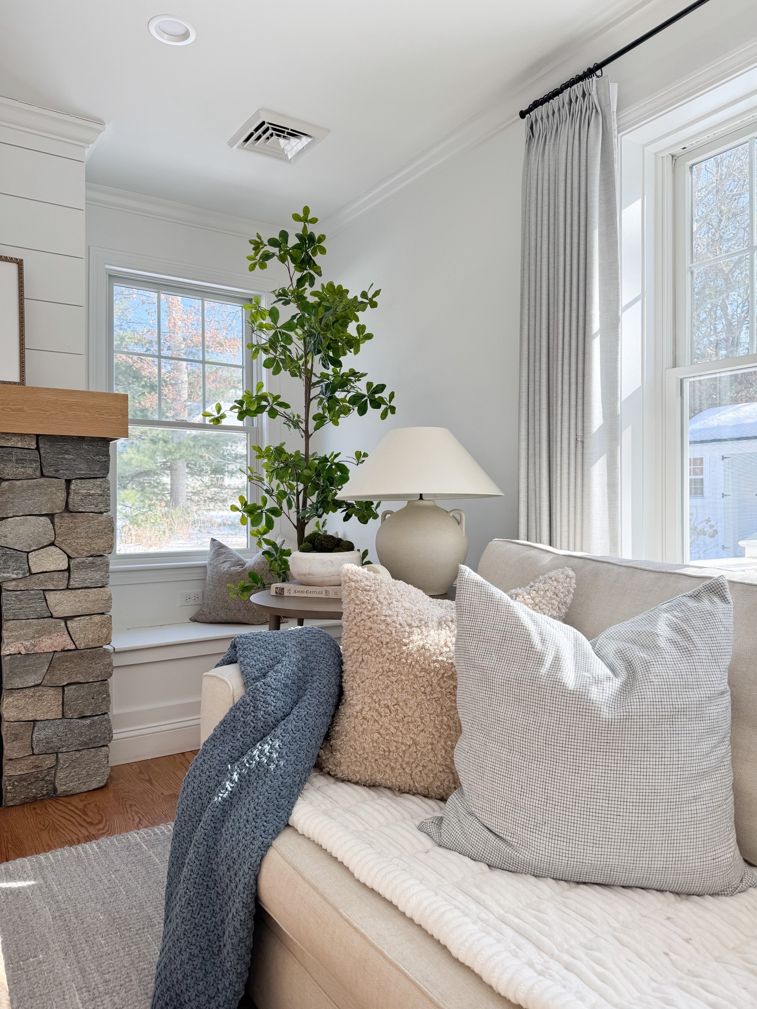 This cozy corner is a favorite spot during all seasons! 🤍 I’m shocked these throw pillows are still in stock. This faux olive tree from Amazon, which is affordable and looks so lifelike.

#LTKHome