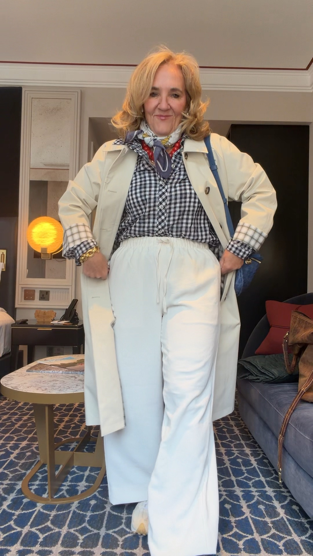 Planning a London vacation? 

Aritzia pants in med reg and I had them hemmed 
Trench med petite
Gingham blouse medium
Cashmere sweater is very relaxed so size down if you want it fitted. I’m in a medium and wore it over my shoulders almost the entire trip. 

Classic layers and comfortable chic pieces are the key! A gingham button-down, lightweight trench, white wide leg pants, and comfy sneakers create the perfect polished travel outfit for sightseeing, shopping, afternoon tea, and exploring the city in style. 🫶🏻 

 #LTKootd #LTKOver40 #LTKTravel