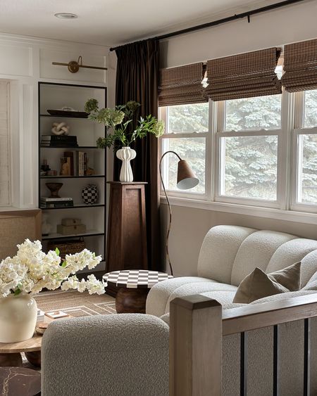 My living room window treatments!These woven roman shades are blackout which I love for privacy at night. The pleated velvet brown curtains are bold yet so elegant. 

#LTKstyletip #LTKhome