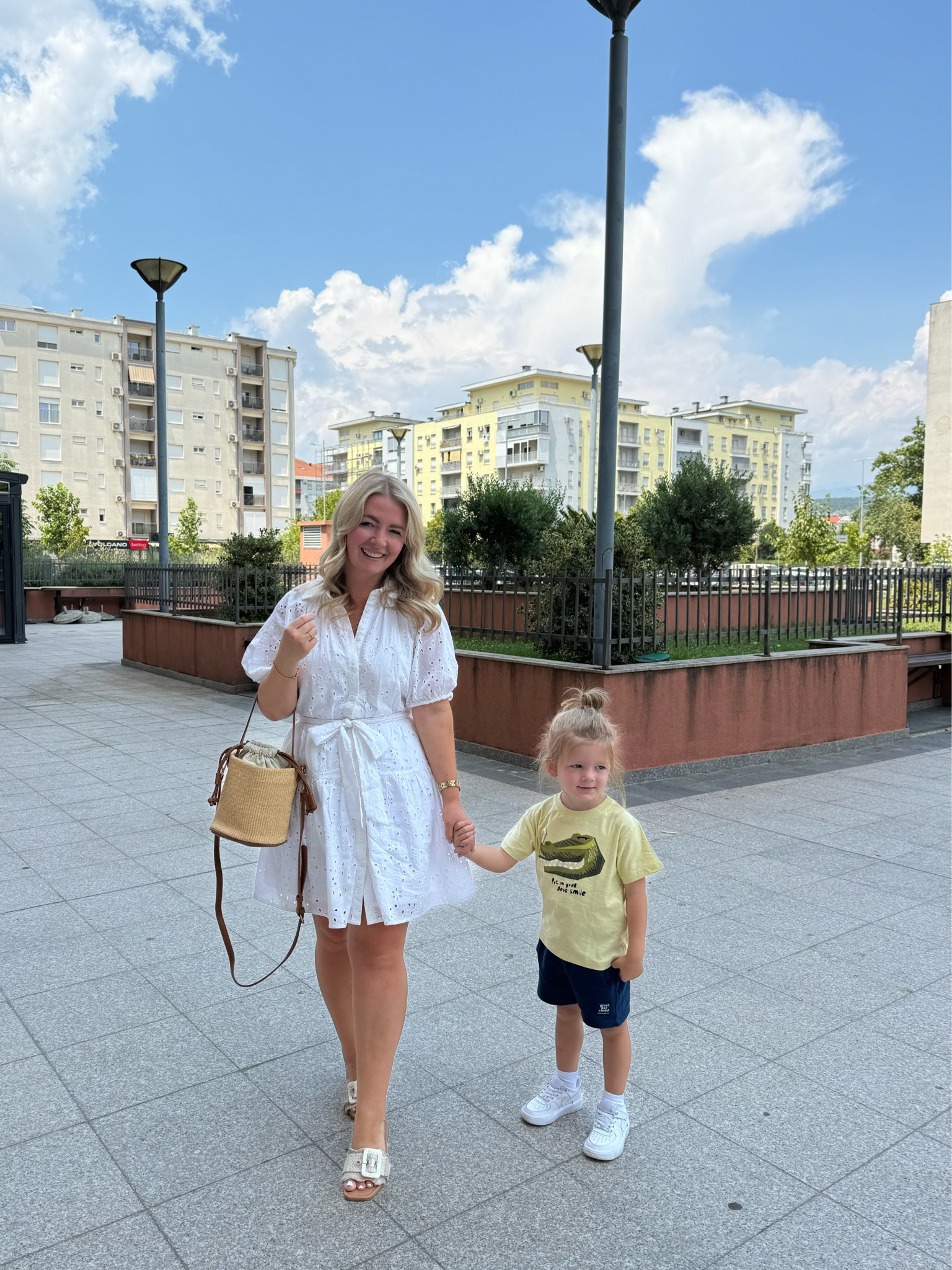 Outfit for strolling the city of Podgorica, Montenegro with my youngest (his outfit is from Zara and cannot be linked). I love how versatile this dress is to dress up or down. And this bag is perfect for summer! 

Summer dress, white dress, sandals, bag, summer bag, summer sandals, white dresses, vacation outfit, 

#LTKKids #LTKMidsize #LTKxNSale