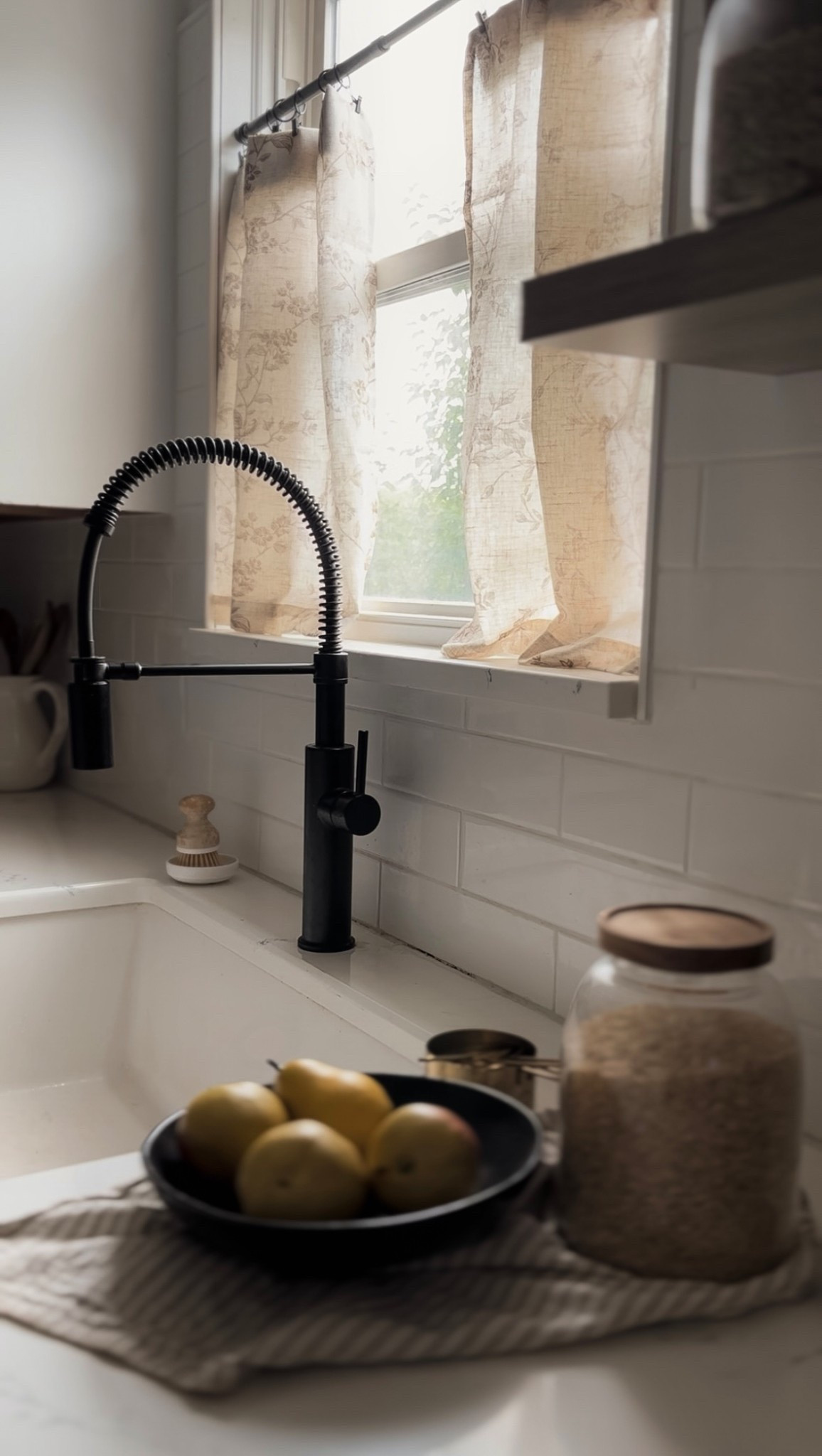 Cafe curtains, patterned curtains, floral curtains, white subway tile, kitchen backsplash, Zillige tile, black kitchen faucet 

#LTKSaleAlert #LTKHome #LTKFindsUnder100