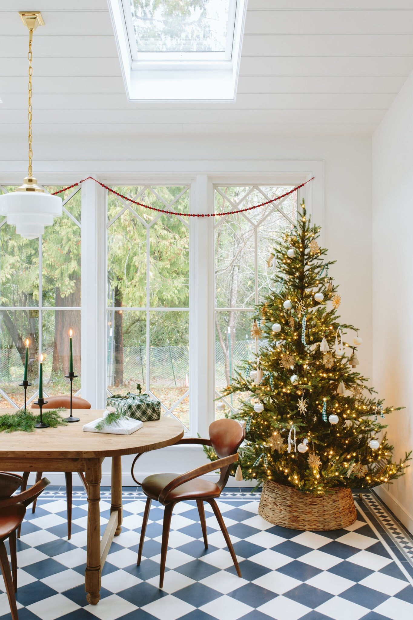 In the sunroom/office is where I got to do a more curated tree and I loved how it turned out. I bought a box of vintage silk-wrapped balls and the wood snowflakes from the antique mall, mixed it with some wood tree ornaments from Target, and ripped fabric. So happy. I also love this faux tree so much and wish I had bought the bigger version of the tree for our living room (and might next year if it comes back in stock). It looks super natural and organic (you’ll see our other one is too triangular and dense for me – but not tree-shaming myself!).

#LTKHoliday #LTKCyberWeek #LTKhome