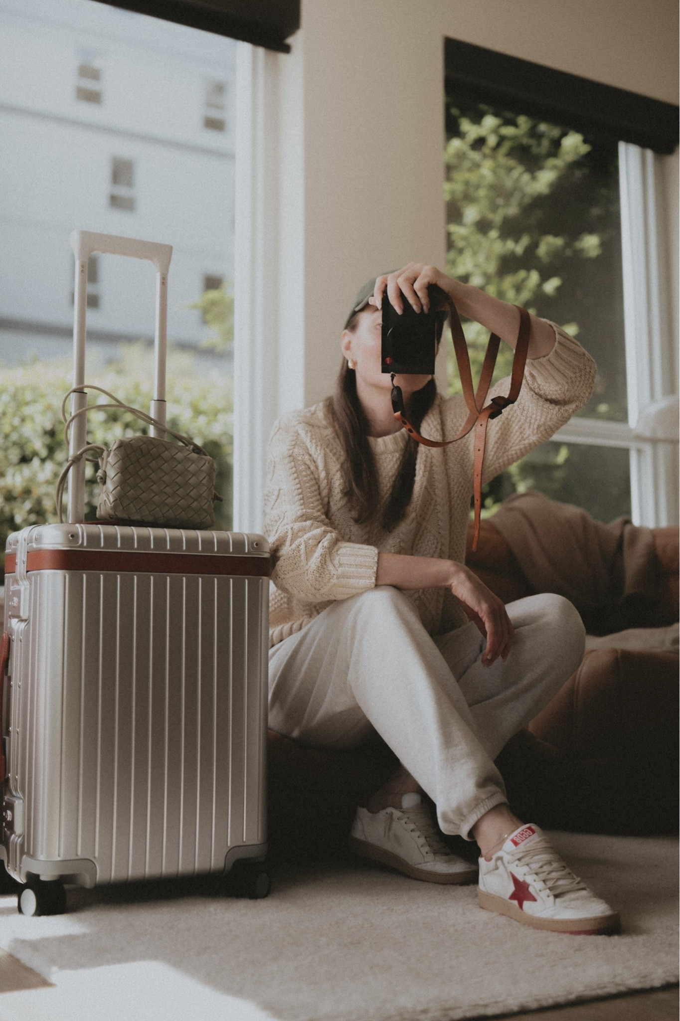 Plane outfit: sweatpants + fisherman sweater + sneakers + mini bag + a gorgeous looking piece of luggage 
Carry on: Carl Frederick 
Sweatpants: Buck Mason 
Sneakers: Golde Goose Ball Star 
Sweater: L.L. Bean 
Crossbody: Bottega Veneta mini loop

#LTKSeasonal #LTKootd #LTKTravel