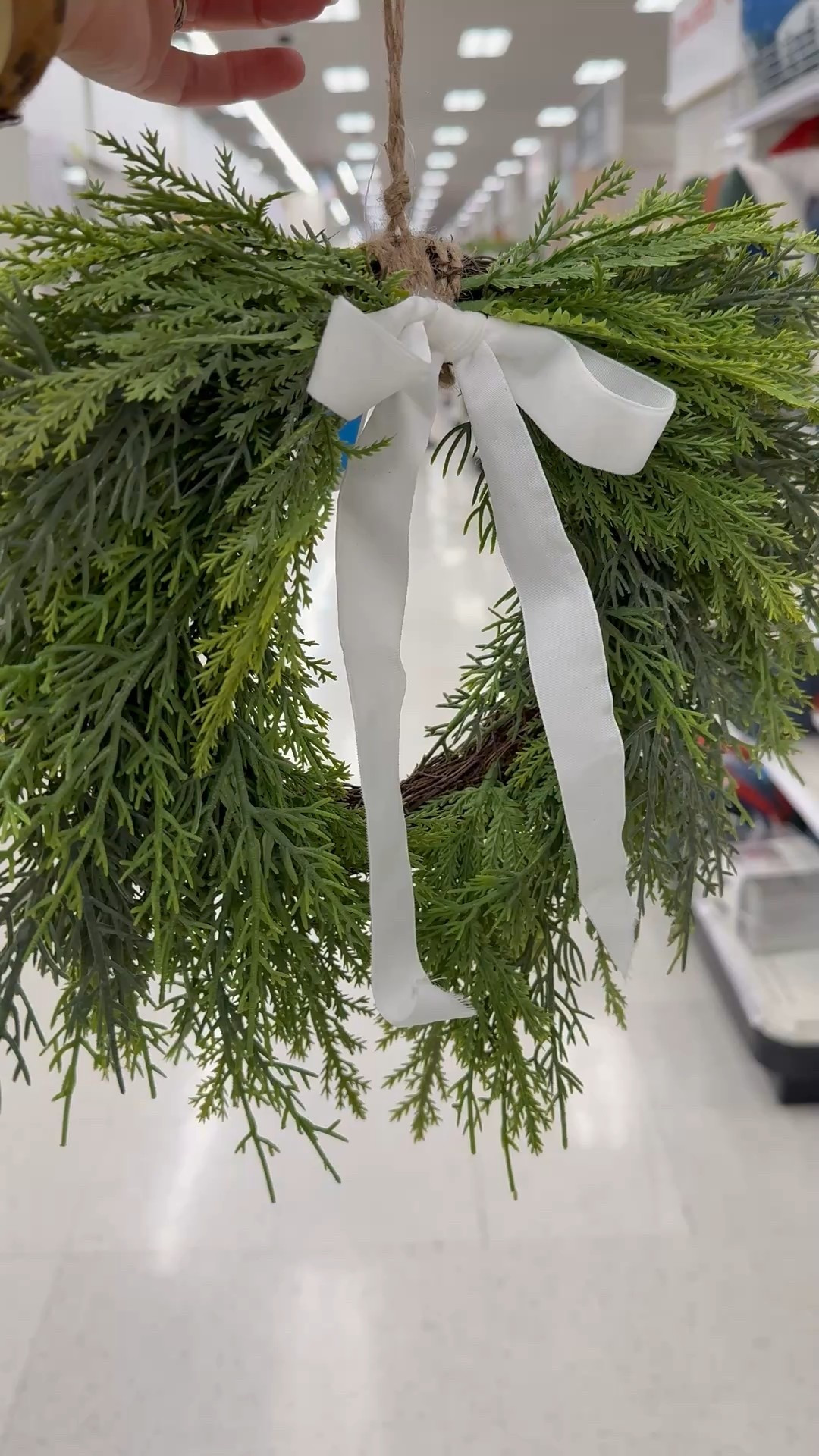 Beautiful Draping Cedar Mini Christmas Wreath from Target. This is the perfect size to hang on your cabinets or the back of dining chairs. I would suggest replacing the ribbon with a red/burgundy velvet one instead. 

#LTKHome #LTKHoliday #LTKStyleTip #LTKFindsUnder50