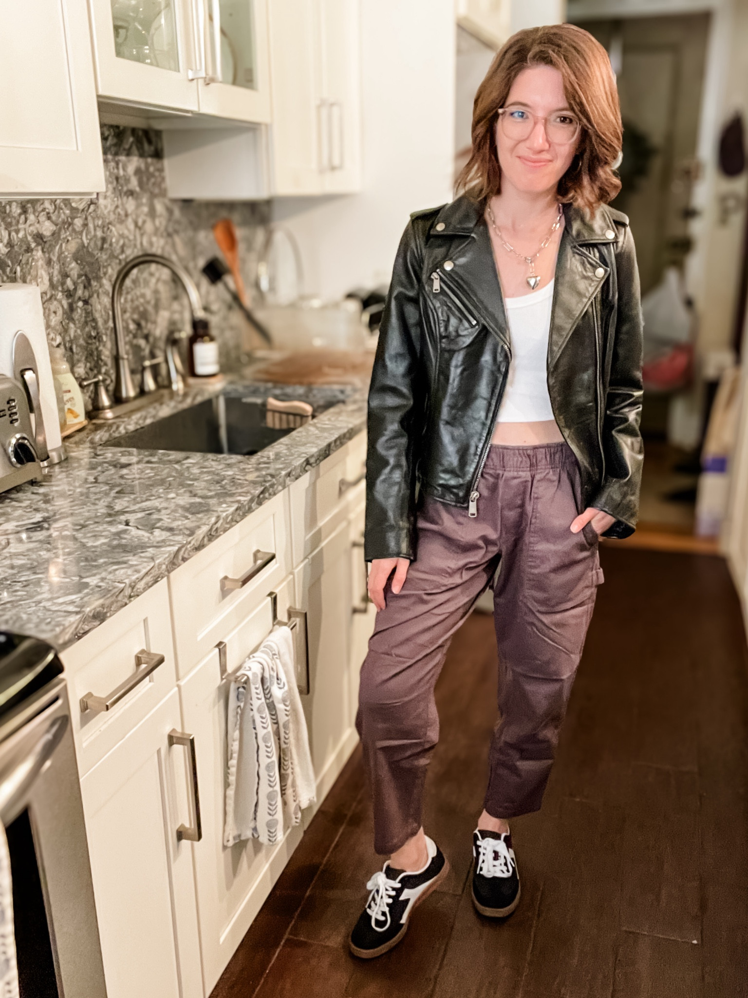 Leather jacket: TTS
Cropped tank: TTS
Pull on pants: TTS, if between go down. Wearing the petite length
Sneakers: TTS

Fall outfit | leather jacket | purple pants | black sneakers | travel outfit | weekend outfit 

#LTKStyleTip #LTKSaleAlert #LTKTravel