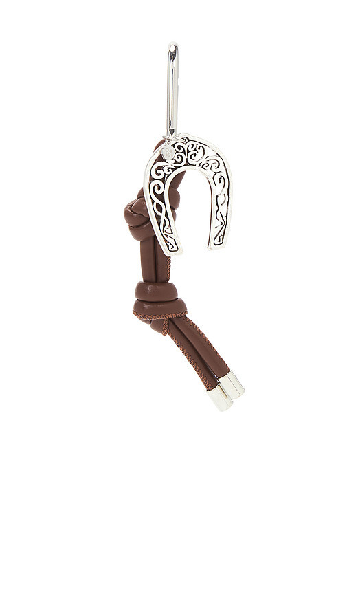 petit moments Lucky Bag Charm in Brown. | Revolve Clothing (Global)