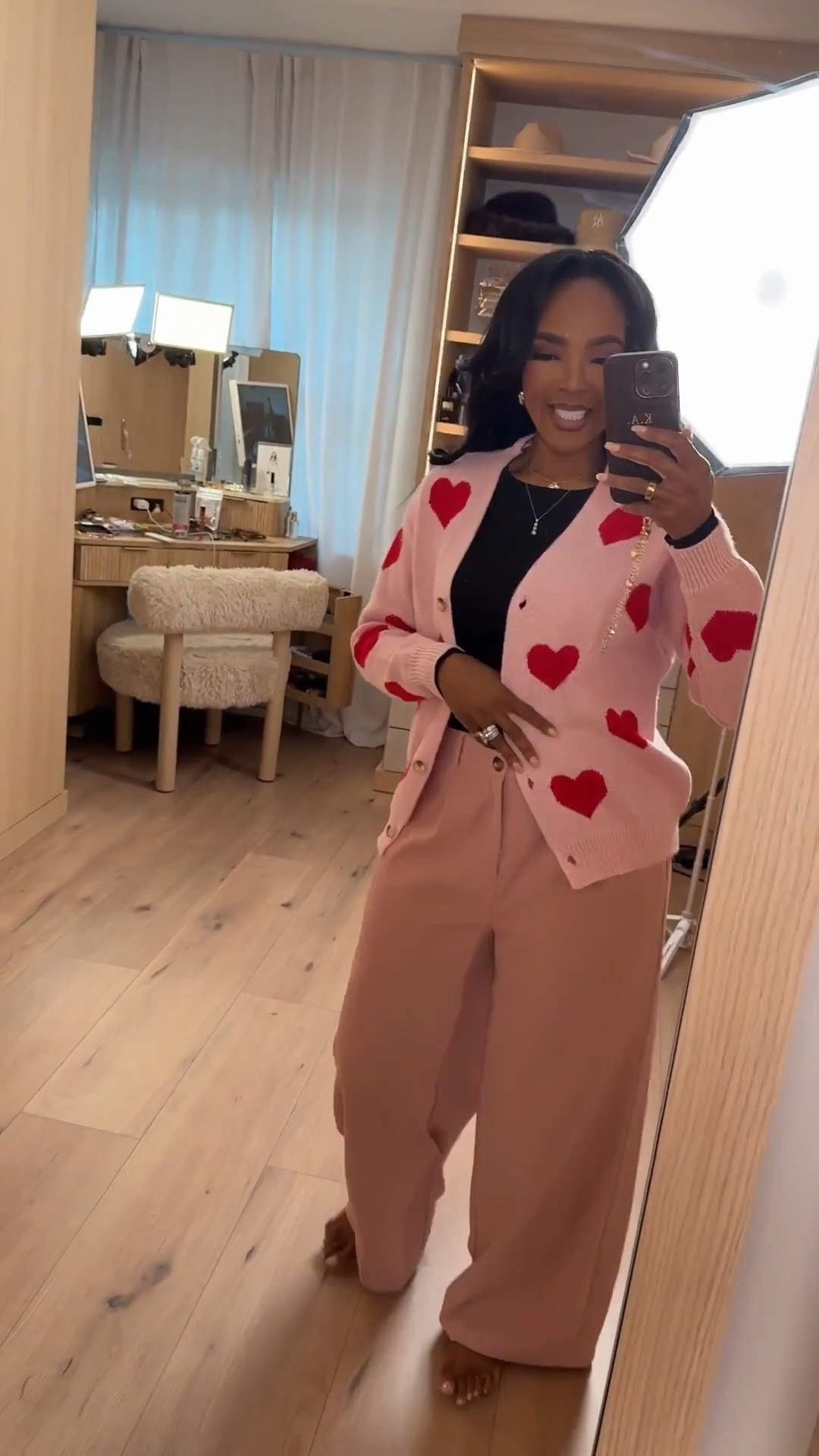 Soft romance, styled the easy way — this heart cardigan layered over tailored trousers is a perfect balance of cozy and polished. A simple black base keeps the look grounded while the playful details make it feel special. This is one of those outfits you’ll reach for year after year, so the cost per wear drops fast.

Perfect for Valentine’s plans, casual dinners, workdays with personality, coffee dates, or weekend errands.

📏 Sizing:
Heart cardigan: Small  
Black top: Small  
Pink trousers: Small  
Height: 5'4" | Weight: 138 lbs | Bust: 34D | Waist: 27" | Hips: 40"

Save this post to come back when you’re planning an outfit that feels cute but still effortless.  
Affordable Valentine outfit, pink trousers outfit, heart cardigan look, Express Valentine outfits, work to weekend outfit ideas, cost per wear fashion staples.

Follow me on Instagram and YouTube @kirasfashionfinds

Follow my LTK @kirasfashionfinds on the @shop.LTK app to view this post and get my exclusive app-only content!

#liketkit 
@shop.ltk
https://liketk.it/5L0Iq