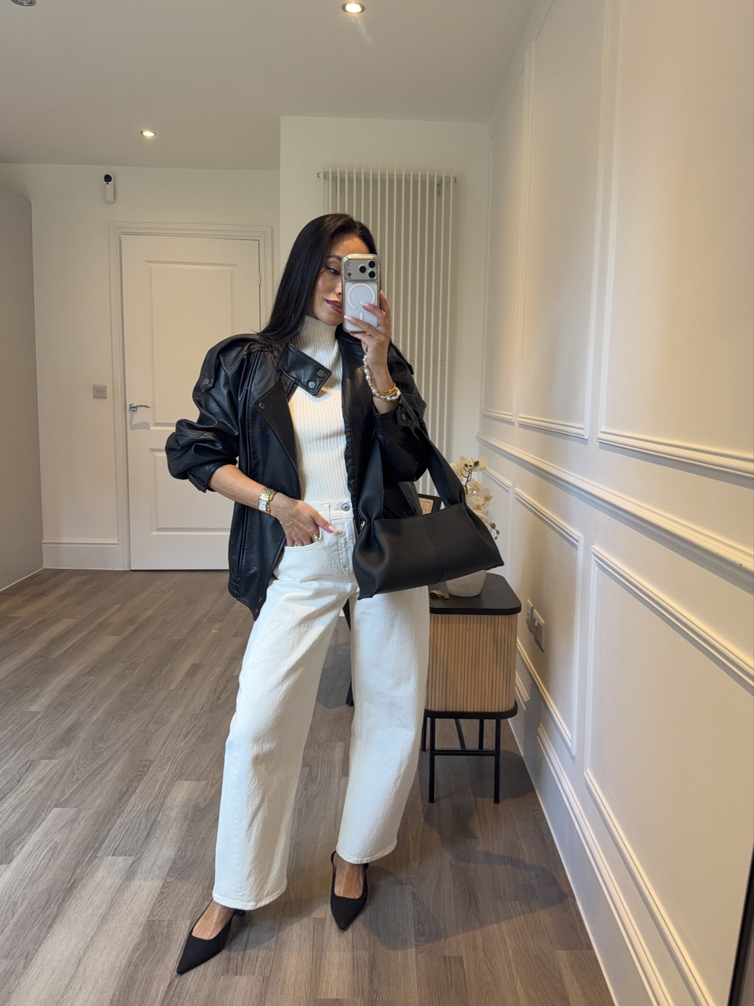 OOTN for a cool girl date night vibe 🖤 oversized leather jacket with an all white look underneath, barrel jeans with slingback heels and Polene handbag

#LTKdatenight #LTKstyletip #LTKspring
