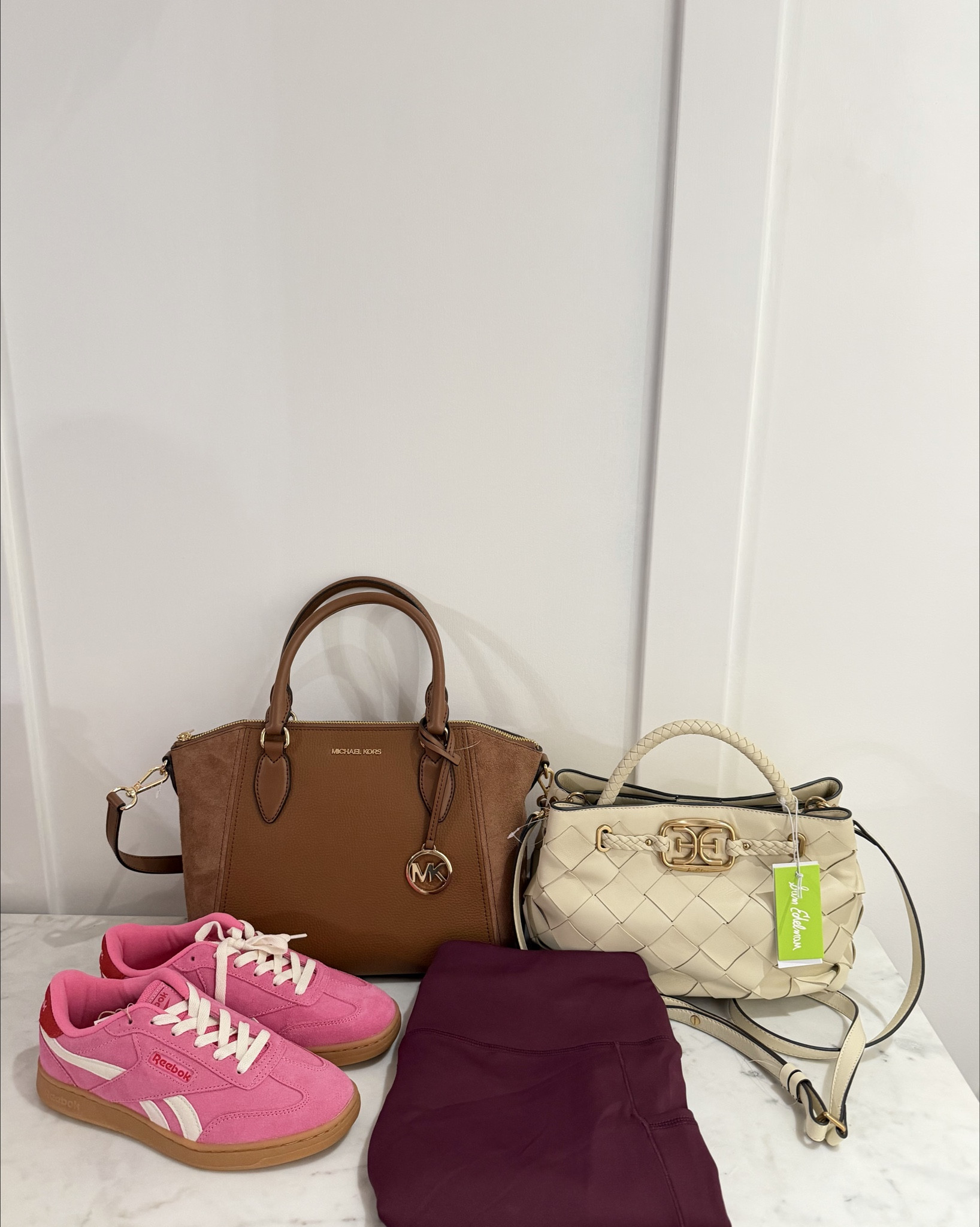 Happy Sunday!☺️ Shopping @tjmaxx and first stop is handbags!!👜 😍 When I saw this Michael Kors handbag in the same suede/leather combo in a different color that I bought before that I shared with you, I just had to immediately put this in my cart!!🤎🛒🤩 The chocolate color that I have is so beautiful and versatile that I knew I’d love carrying this lighter color around!!😁 I took a picture of both of them together to show you!😊 Remember the olive green color of this same exact handbag?🤔 
I passed on that and happy I waited for a different color because this one is even prettier!!😉 I love the details on this Sam Edelman woven satchel handbag!!🤍😍 The braided top handle and supple leather with the woven leather design with magnetic snap closure that can be carried as a crossbody!!🧲☺️ It has its dust bag that goes with it! Same style of these cute Reebok sneakers are on sale for $47.99 in more colors including neutral colors, I found this exact color combo also plus more!!🩷❤️😄 
I loved the Layer 8 Bliss leggings in the olive green color that still look new and I wasn’t familiar with the brand before so I was skeptical! I was happy to see them now in this burgundy color!!☺️ They have 2 pockets!! I get kind of annoyed when there’s no pockets on my leggings!!😂 I linked what I found and more cute handbags on sale!!😁

#tjmaxxhaul #tjmaxxfinds  #michaelkorsbags #samedelman #tjmaxx 

Handbag deals, handbag sale, shoe sale, sneaker sale, spring sneakers, spring shoes, spring handbag, summer handbag, neutral handbag, Reebok sneakers 
#ltktravel 

#LTKOver40 #LTKWorkwear #LTKSaleAlert