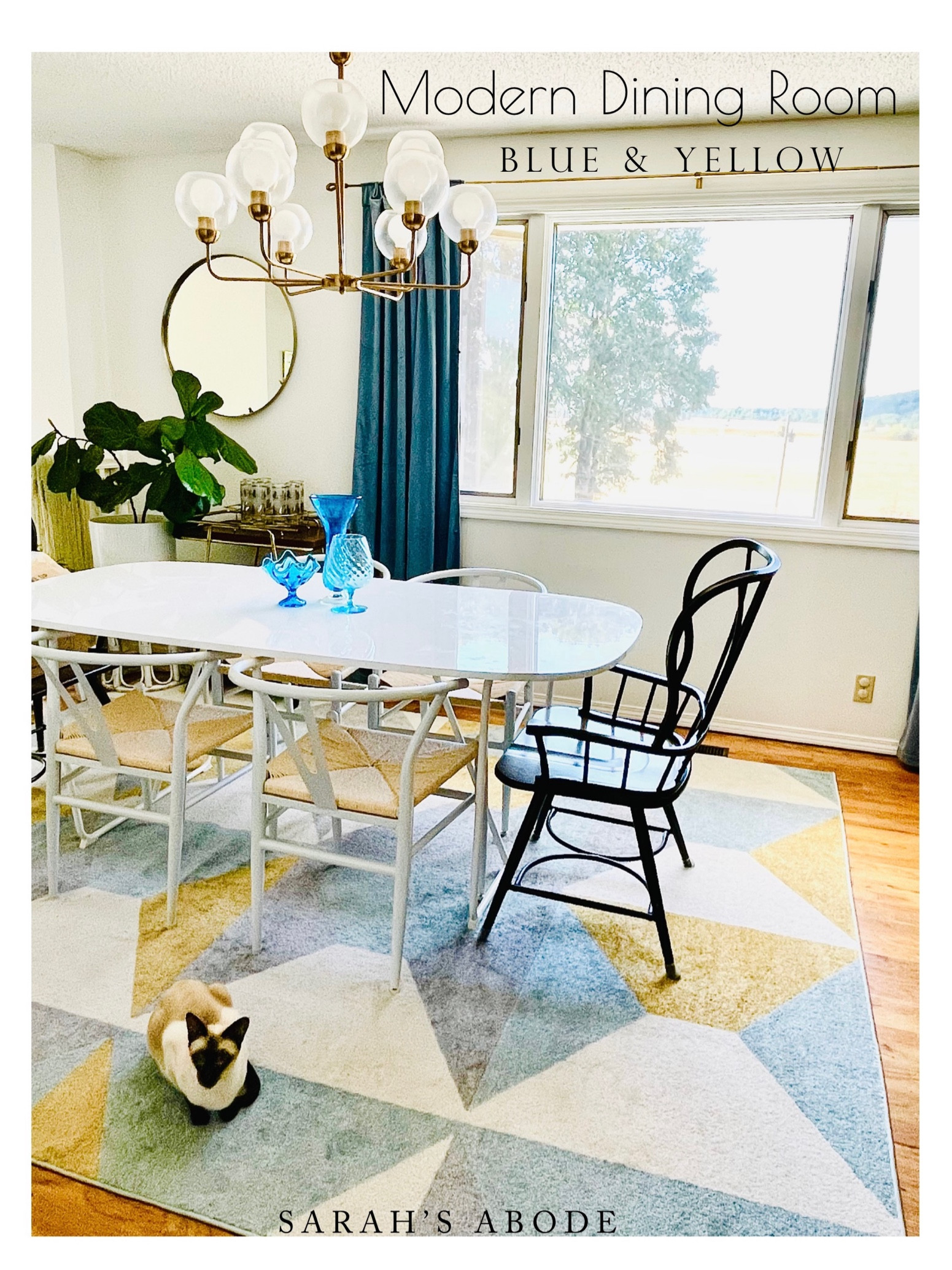 Blue and yellow retro dining room with affordable pieces #amazonfinds 

White dining table.  Modern rug. Geometric rug. wishbone chairs. Gold mirror. velvet curtains. Faux fiddle leaf fig. Gold chandelier.

#LTKstyletip #LTKhome #LTKfamily