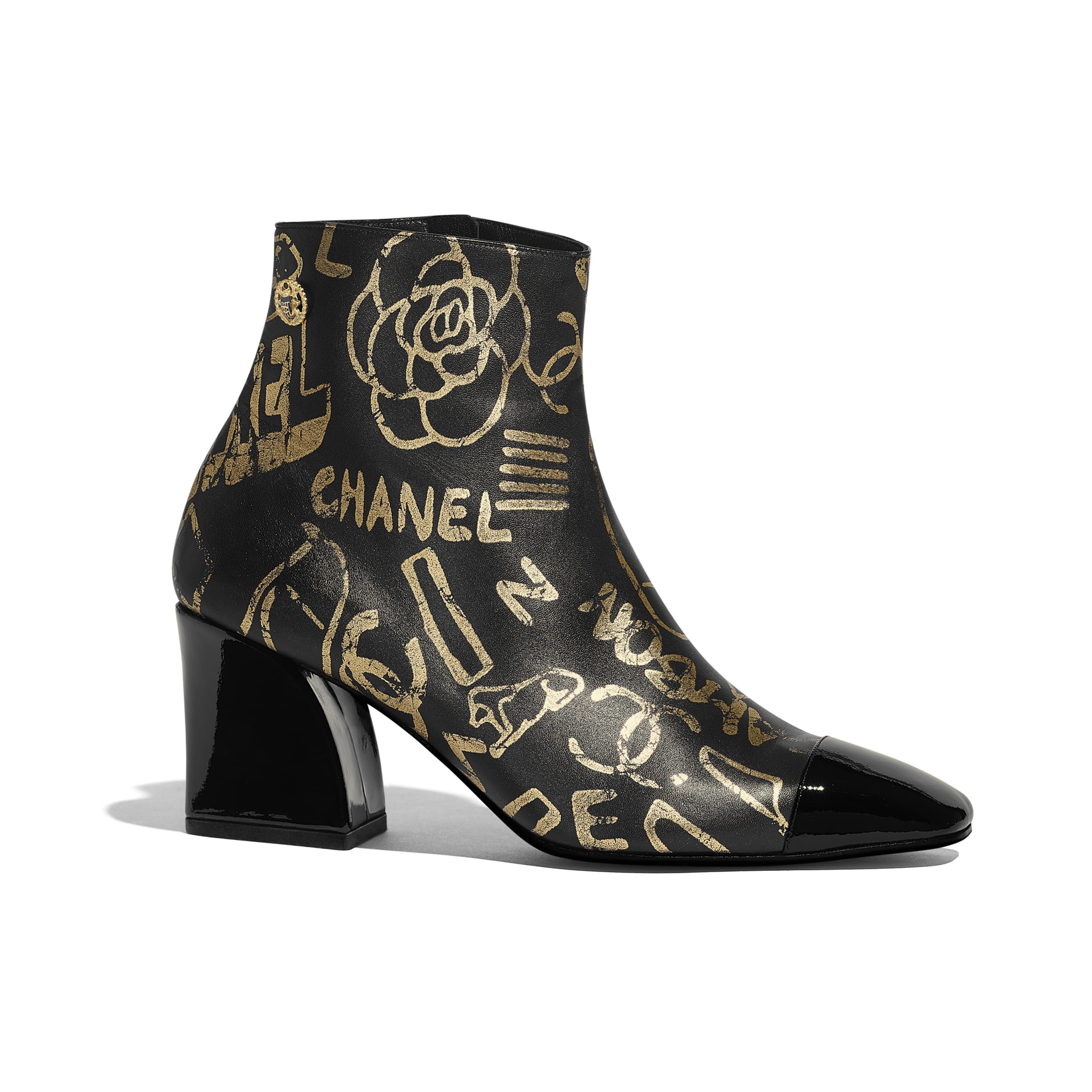 Printed Lambskin & Patent Calfskin Gold & Black Ankle Boots | CHANEL | Chanel, Inc. (US)