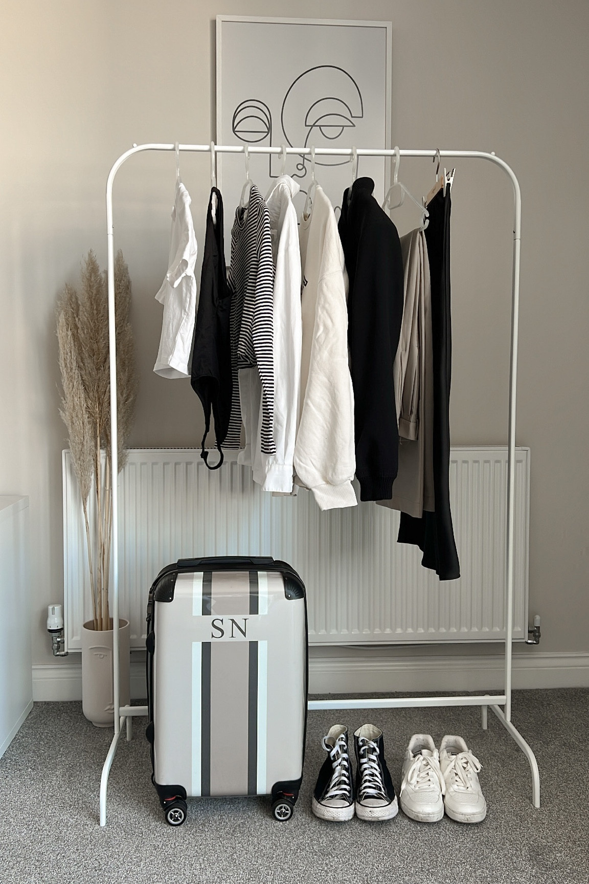 What's in my suitcase bag, jumper striped long sleeve tshirt, converse, white trainers, beige trousers, formal trousers, black bodysuit, white crop top, sweatshirt, jumper 

#LTKeurope #LTKstyletip #LTKSeasonal