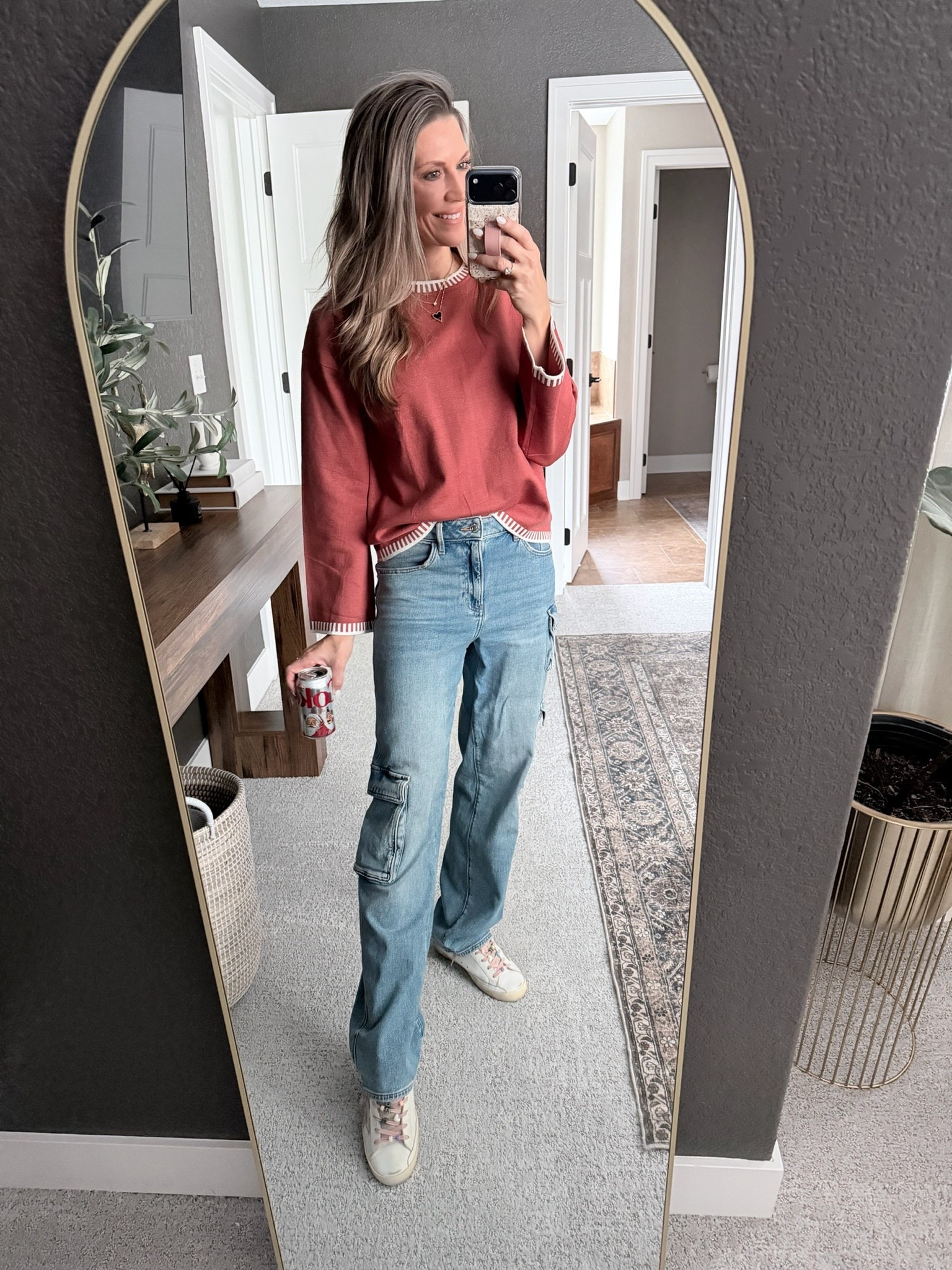 Casual + comfy outfit of the day ✨ Styling a cozy rust sweater with relaxed cargo jeans for an easy everyday look. These wide-leg cargos are perfect for running errands or mom-life days, and I love how the neutral sneakers keep it laid-back but put-together. If you’re looking for cute fall outfits, casual winter style, or everyday wardrobe staples you can wear on repeat—this combo is a winner. Shop the full look below! 🧡👖🤍

#LTKdayinmylife #LTKOver40 #LTKootd