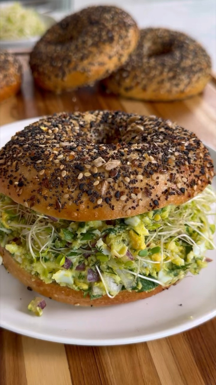 HERBY AVOCADO EGG SALAD is the newest lunch option in my rotation and it needs to be in yours too! What makes this recipe stand out is all of the fresh herbs used-as well as a dash of my favorite spice (cumin) and it's all mashed up to make a salad that's so good, you might eat all of it in one setting. You can eat it straight from the bowl, as a bagel sandwich (I'm using an everything bagel and wowwww so good), over romaine lettuce leaves and so much more. And, you no longer have to peel hard boiled eggs one by one-use the hack shown here, which is to crack eggs into a loaf pan, place into another larger baking dish, fill 3/4 way with water and bake at 350F for 25-30 minutes. SO EASY!

#LTKhome #LTKVideo