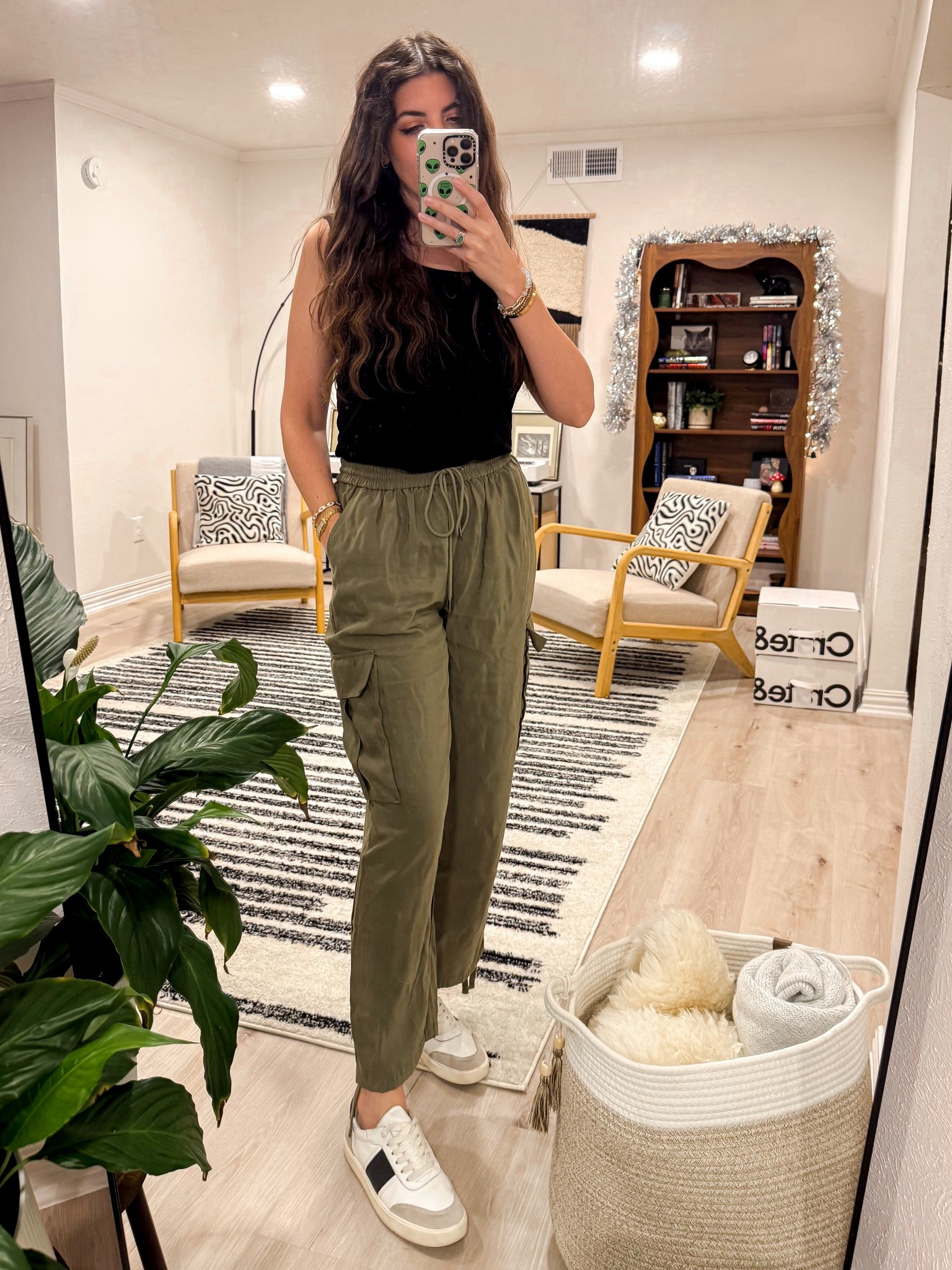 A no-think outfit I’ll wear all season: black tank, olive cargos, neutral sneakers.

#LTKTravel #LTKootd #LTKFindsUnder100