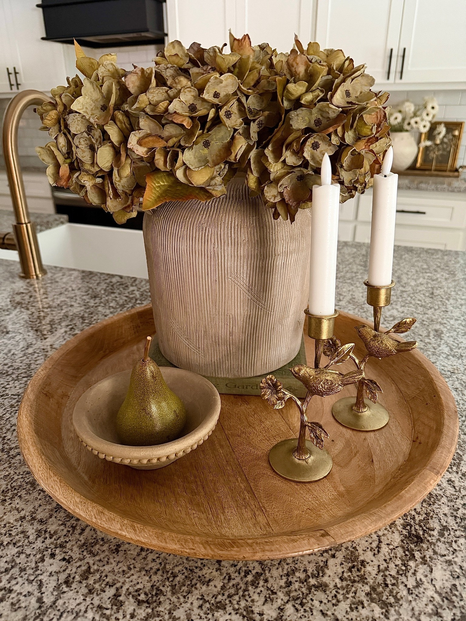 Such a beautiful tray to enjoy now and even into Fall. These dark green hydrangeas add so much richness and warmth to a space, making them perfect for multiple seasons. I paired them with the sweetest bird candlesticks and a beautiful pear nestled in a bowl for a look that feels cozy, collected, and timeless.