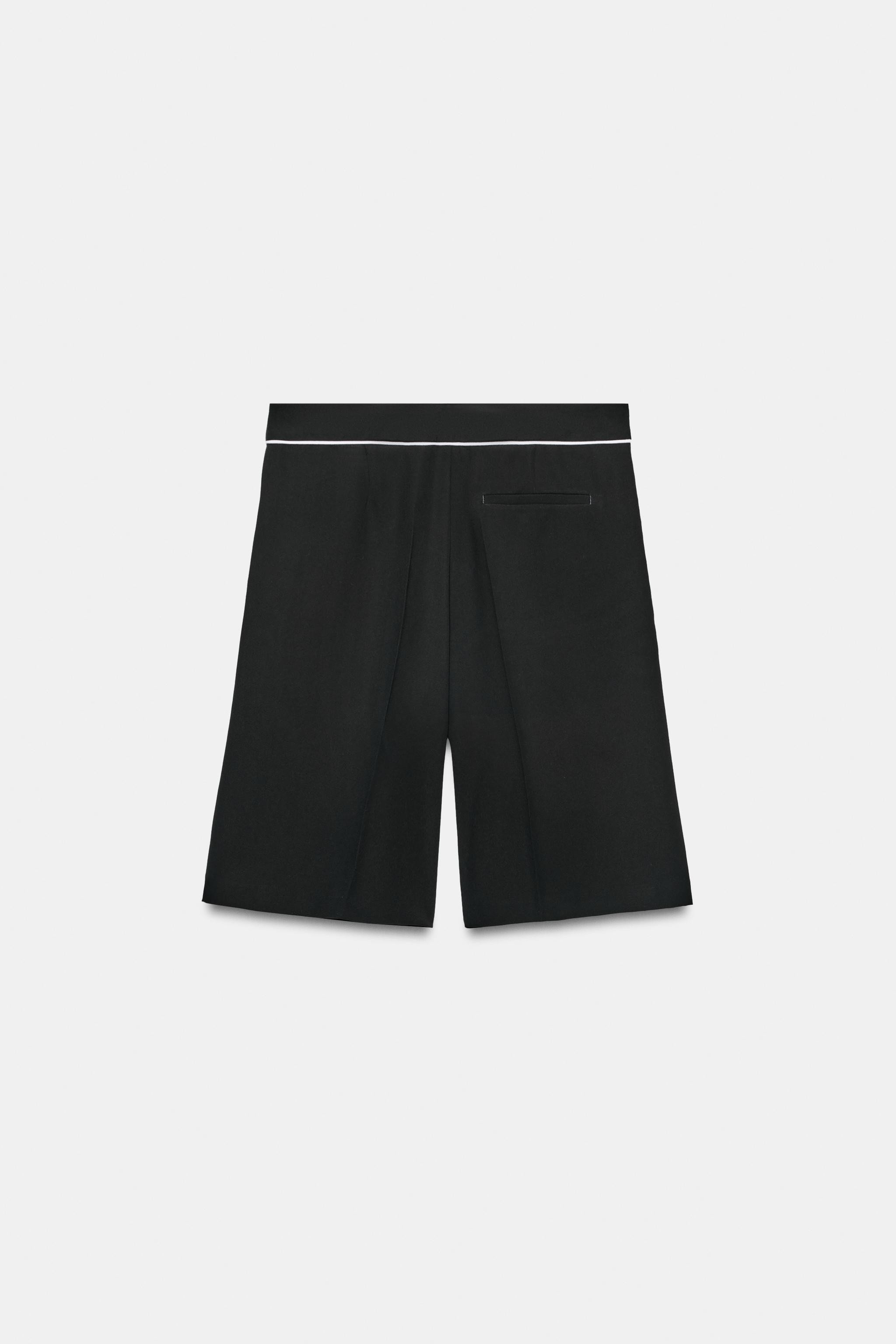 Mid-rise shorts with front pockets and back false welt pocket. Contrasting piped trim detail. Fro... | Zara US