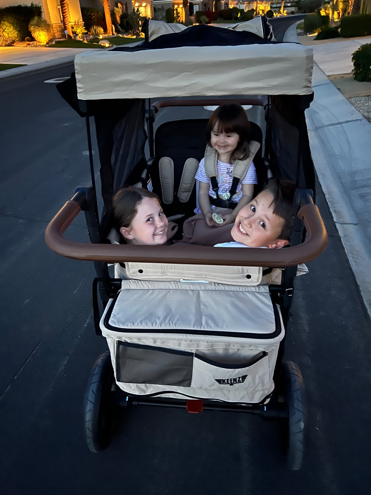 Fits up to 340 lbs and comes with every attachment and gadget you could or could not even imagine! We love this! Perfect for all terrain too!