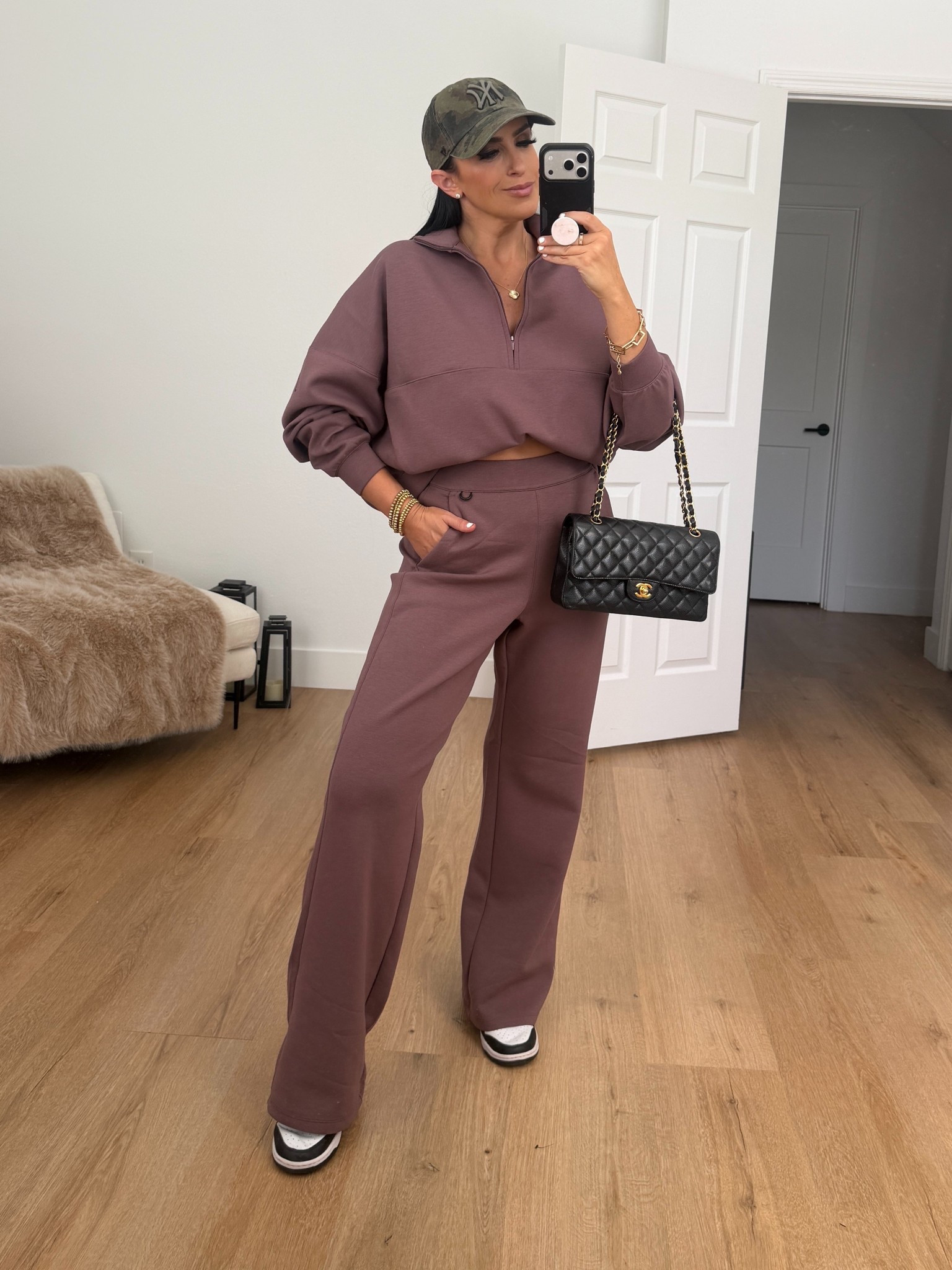 Woman’s Nike 24.7 ImpossiblySoft Dri-FIT Oversized 1/2-Zip top. I’m wearing a size medium. 

Woman’s Nike 24.7 ImpossiblySoft Dri-FIT High-Waisted Loose Flared Pants. I’m wearing a size small. 