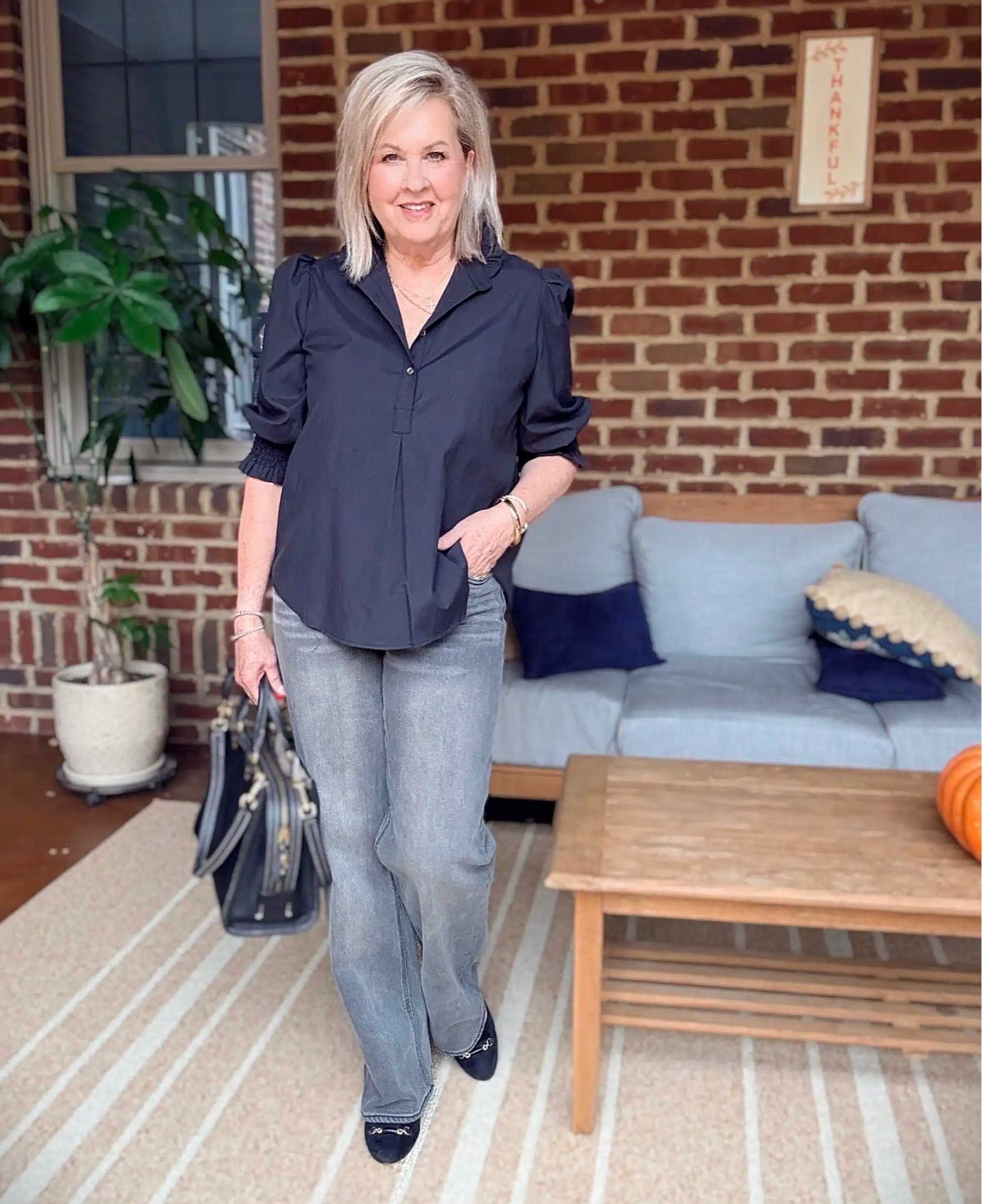 Styling black with gray denim. I love how this look is a mix of classic black pieces with the gray denim jeans. My shirt is a size large and jeans are a 29.