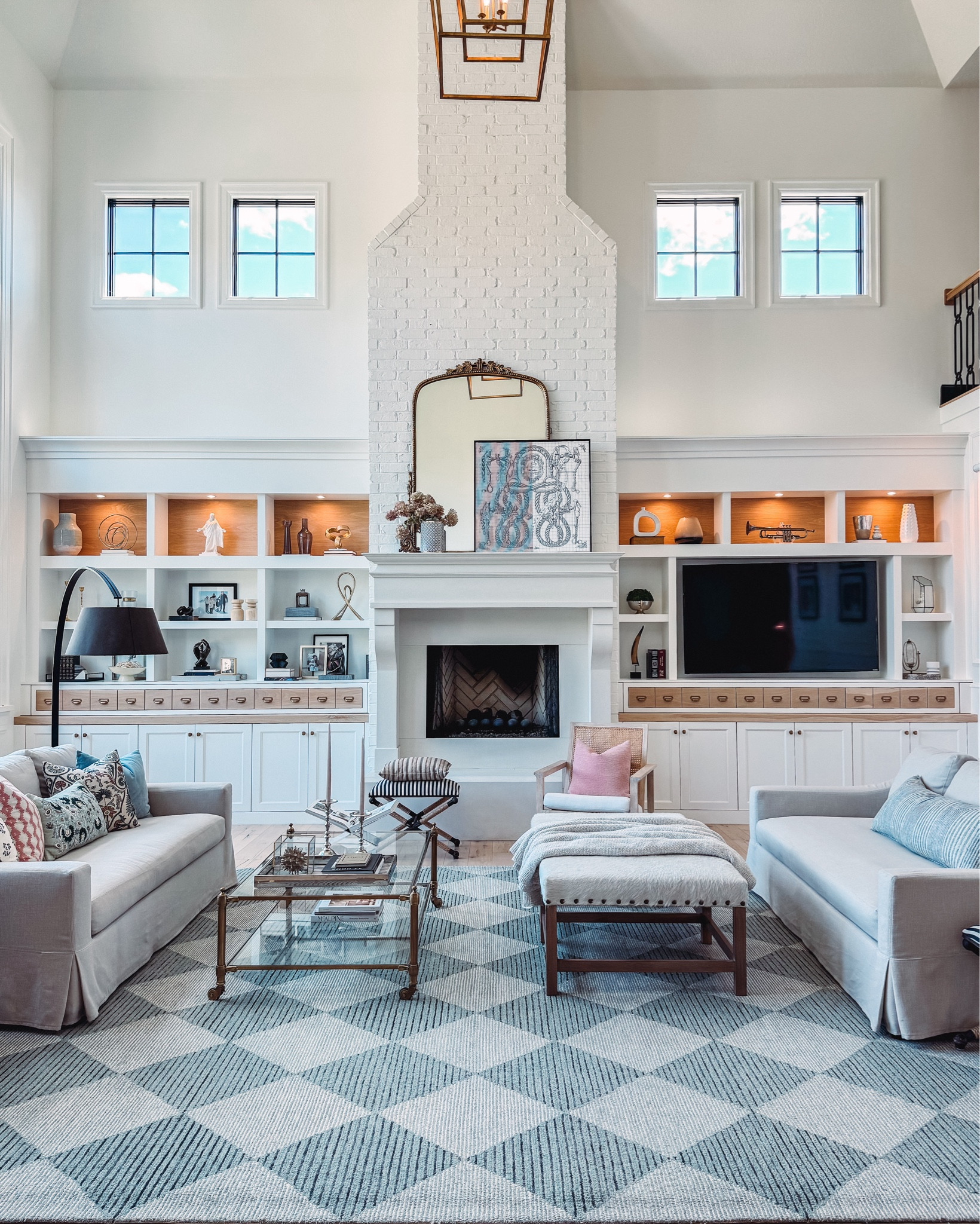 Shop my summer Living room refresh with light blue and terracotta colors. 
Favorite quality throw pillow source and designer inserts.
Checkered rug on sale 
Slipcover sofas ON SALE right noww
Large ottoman discontinued
 brass & glass coffee table 
Layered mirror with framed scarf
Serena & lily Side and console tables on sale 
Faux green stems & blue ginger jar


#LTKHome #LTKSaleAlert